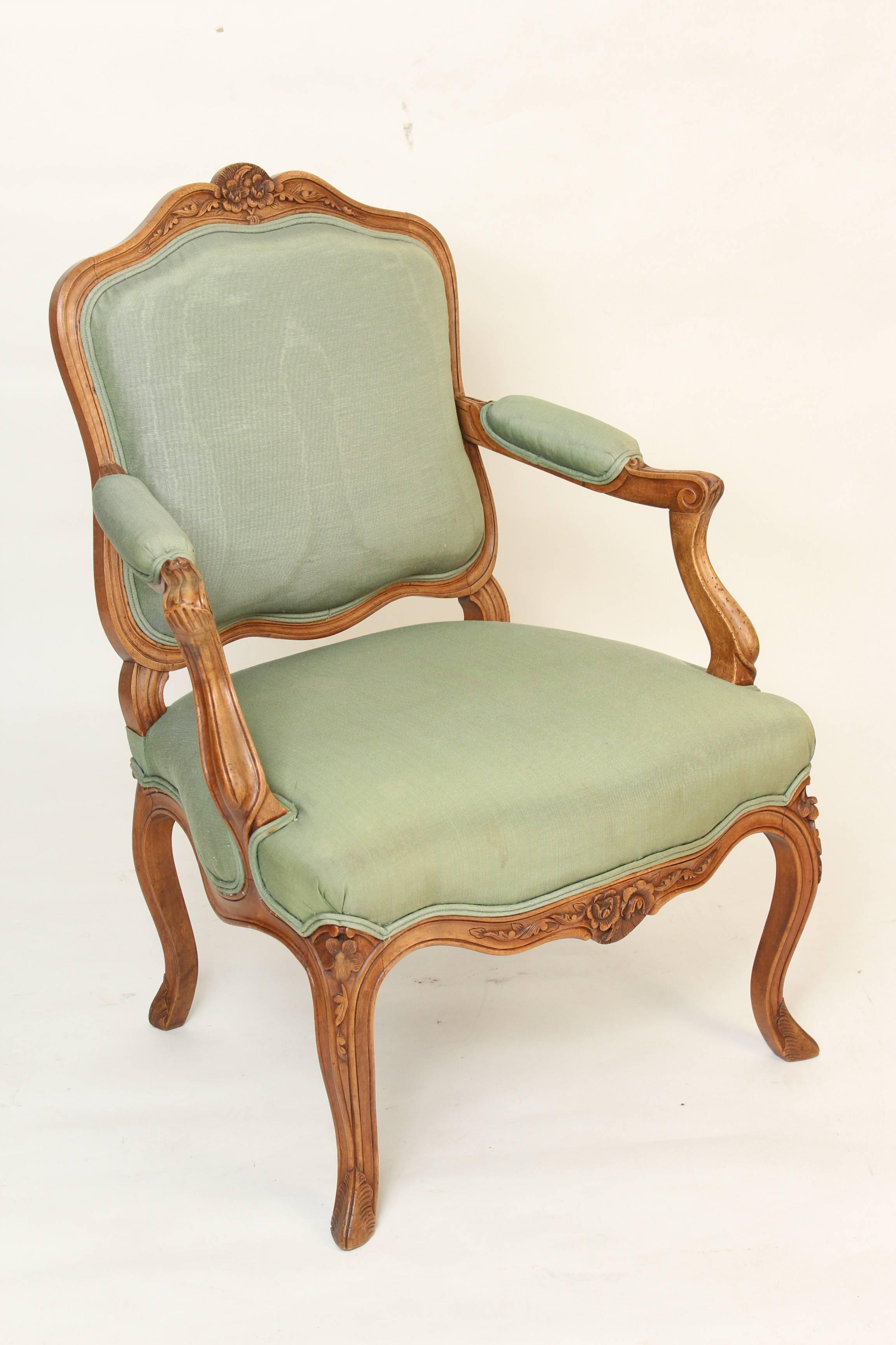 Pair of Louis XV style carved beech wood armchairs, circa 1920.