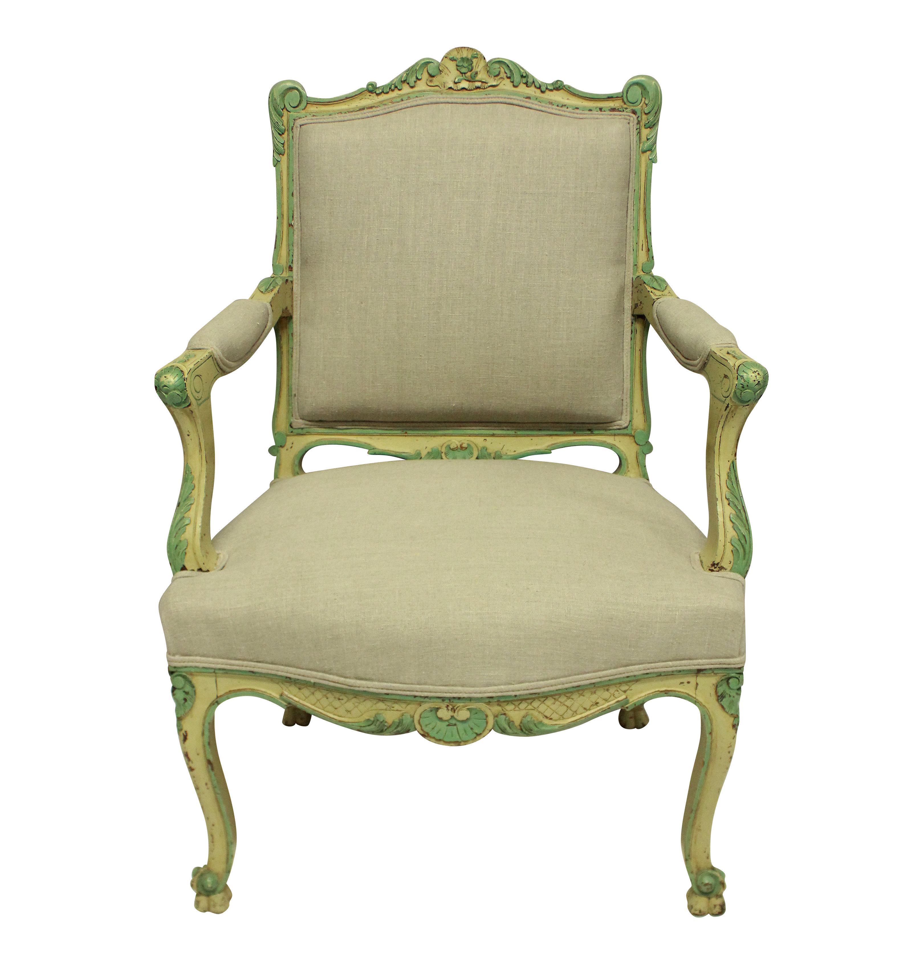 A pair of French Louis XV style walnut armchairs, painted in the 1930s in pale yellows and greens. Newly upholstered in raw linen.