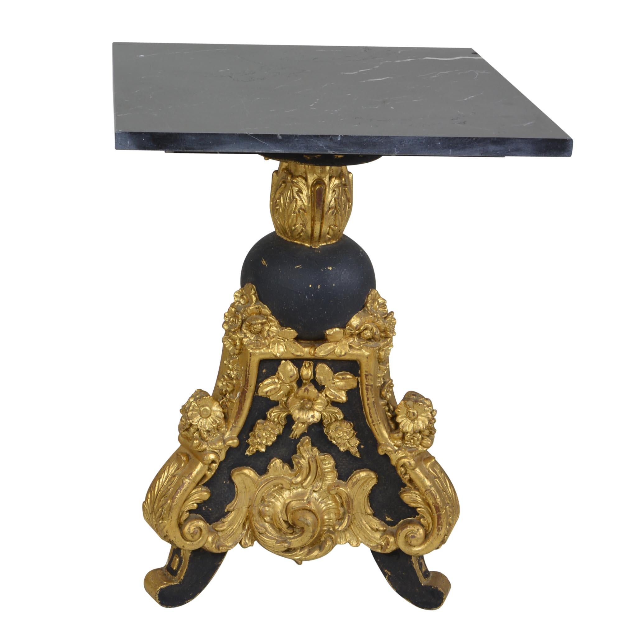 This pair of side tables is sure to add a sense of flair to any room. The square marble tops sit atop the triangular black and gold painted bases. The are small enough to work either as side tables or end tables.