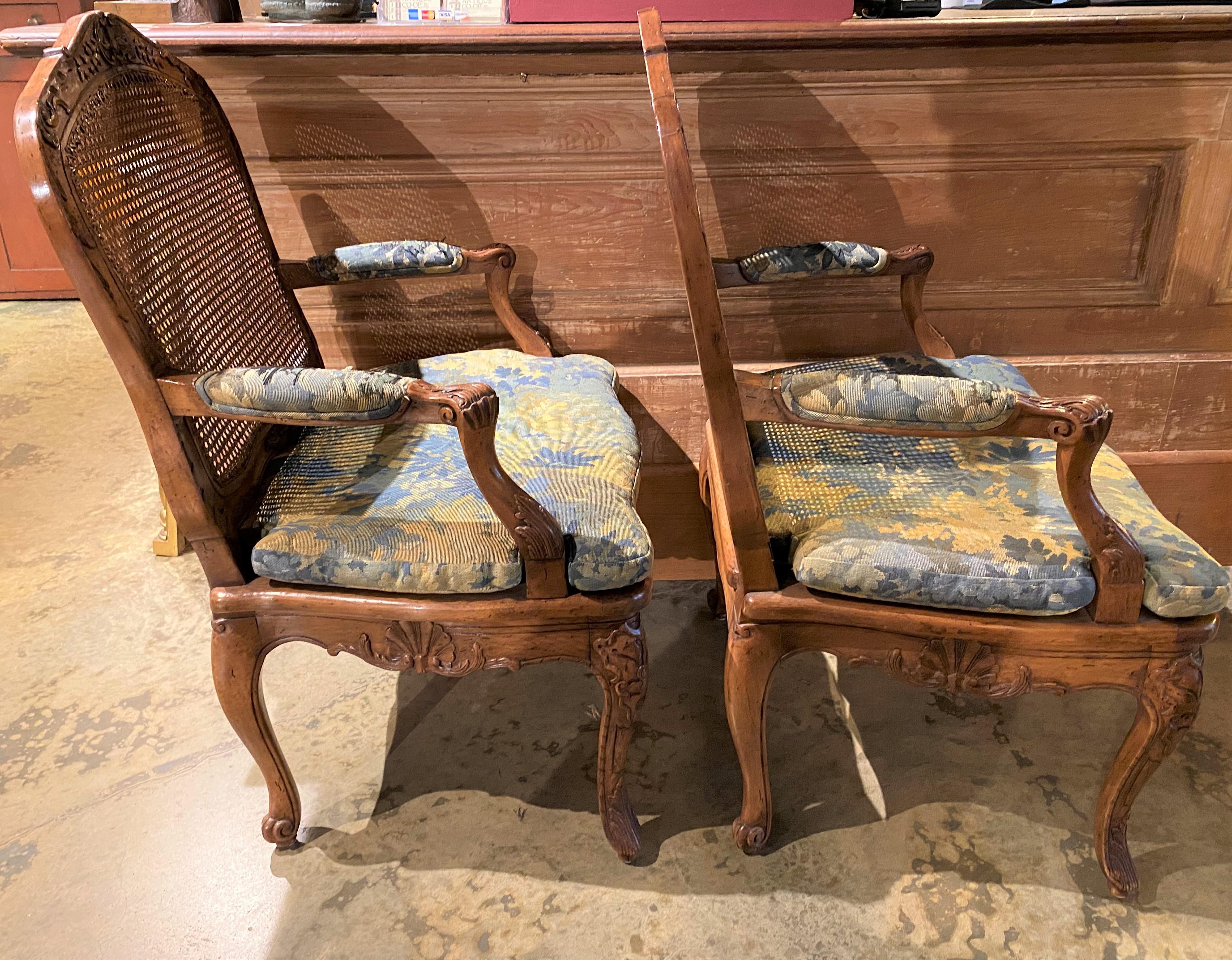 Hand-Carved Pair of Louis XV Style Caned Fruitwood Fruitwood Fauteuils with Upholstery For Sale