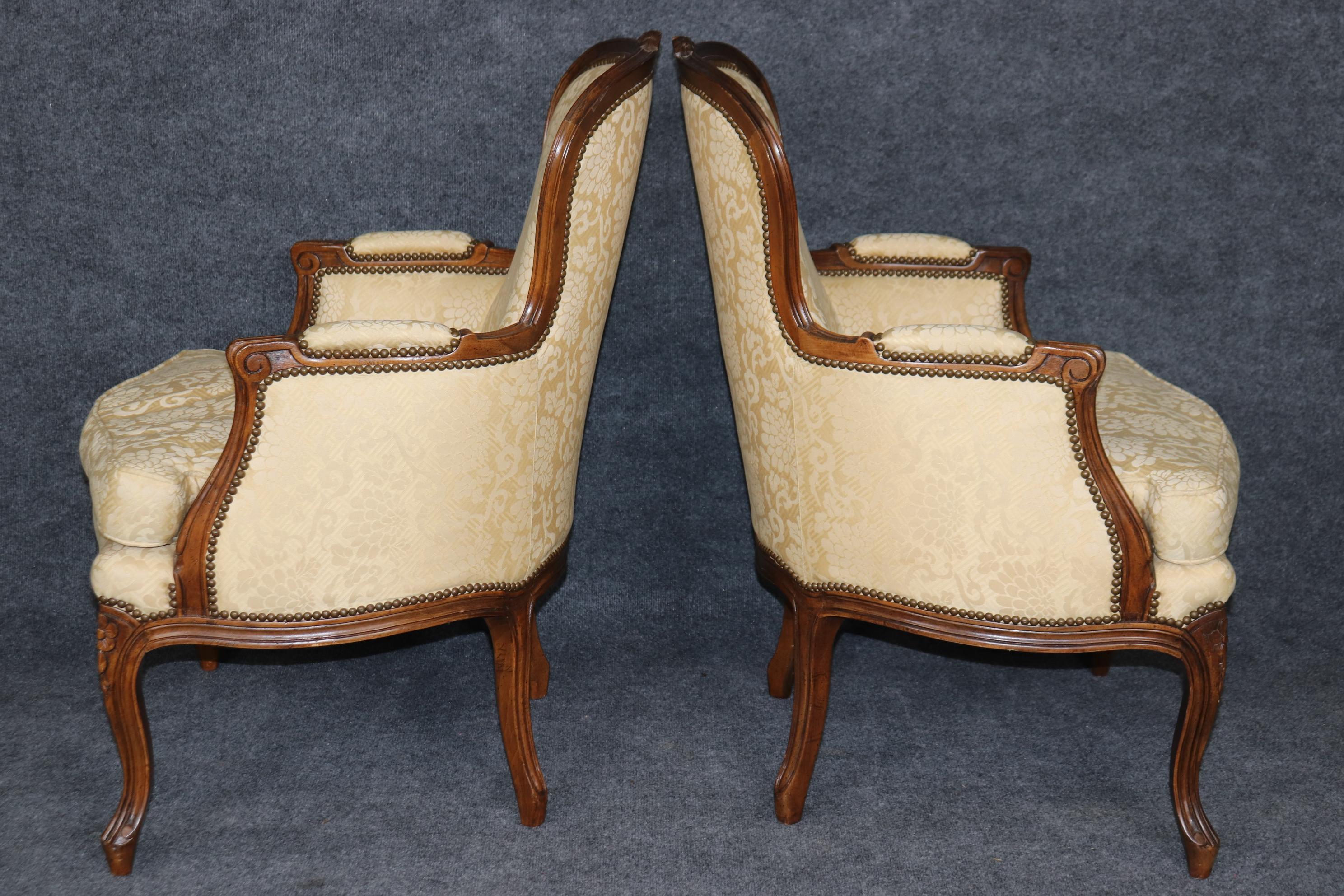 American Pair of Louis XV Style Carved Bergeres with Baker Upholstery and Nailhead Trim For Sale
