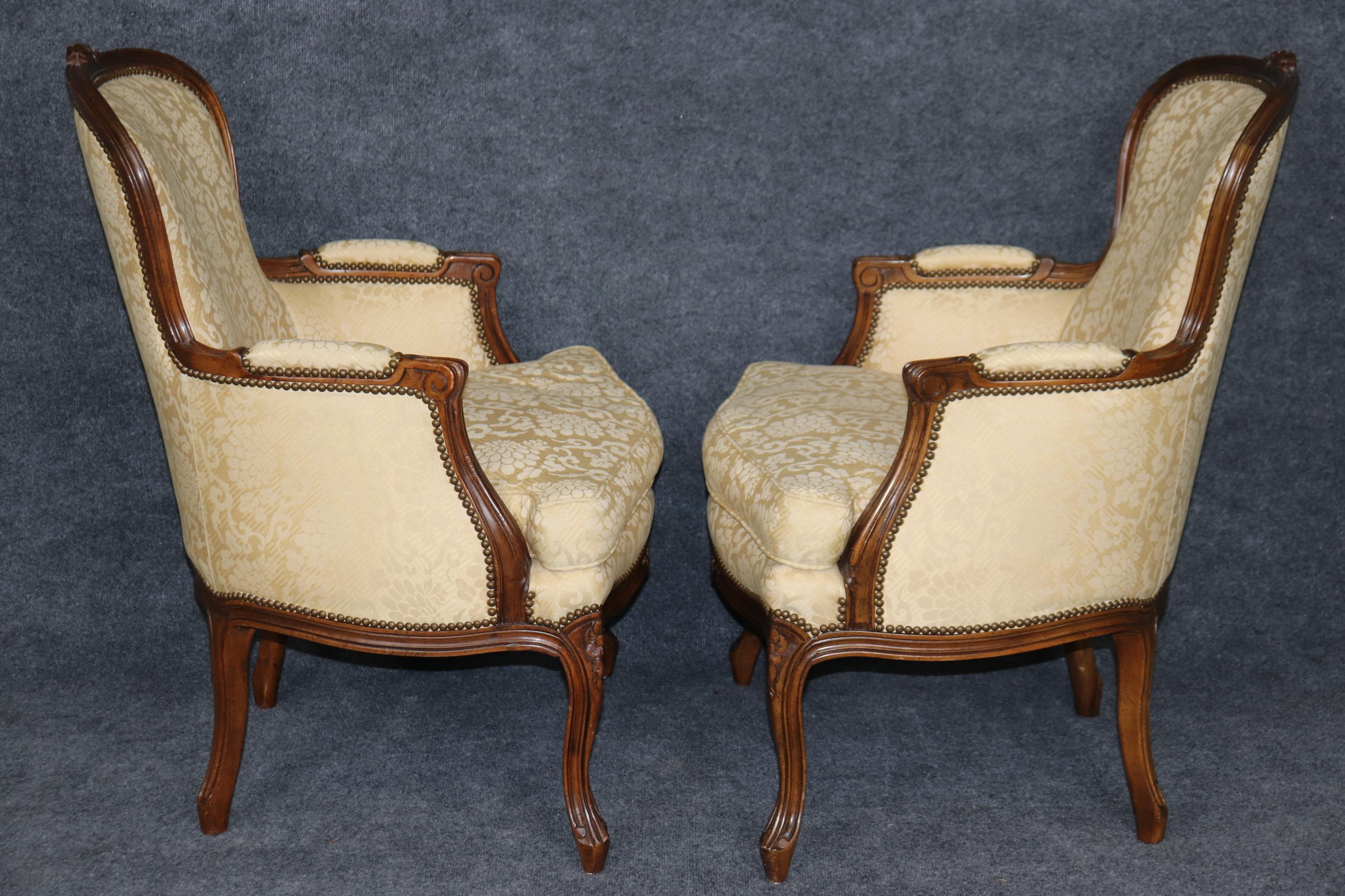 20th Century Pair of Louis XV Style Carved Bergeres with Baker Upholstery and Nailhead Trim For Sale
