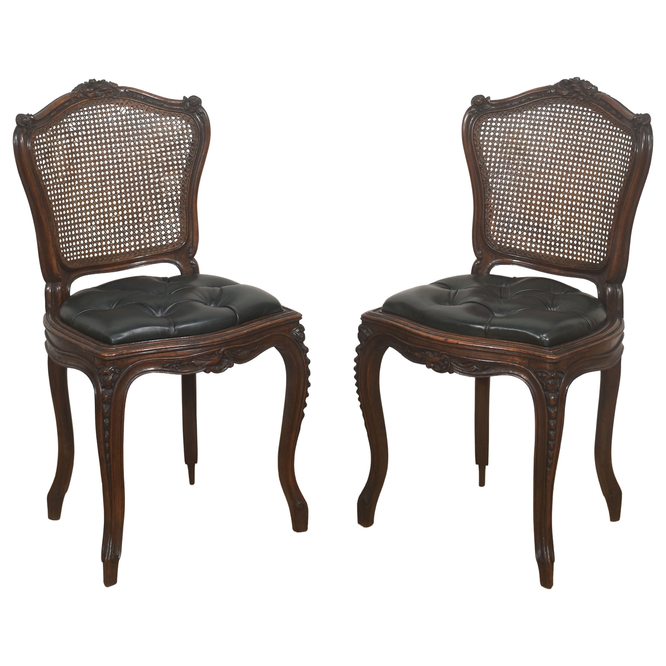 Pair of Louis XV Style Carved Walnut and Caned Side Chairs For Sale