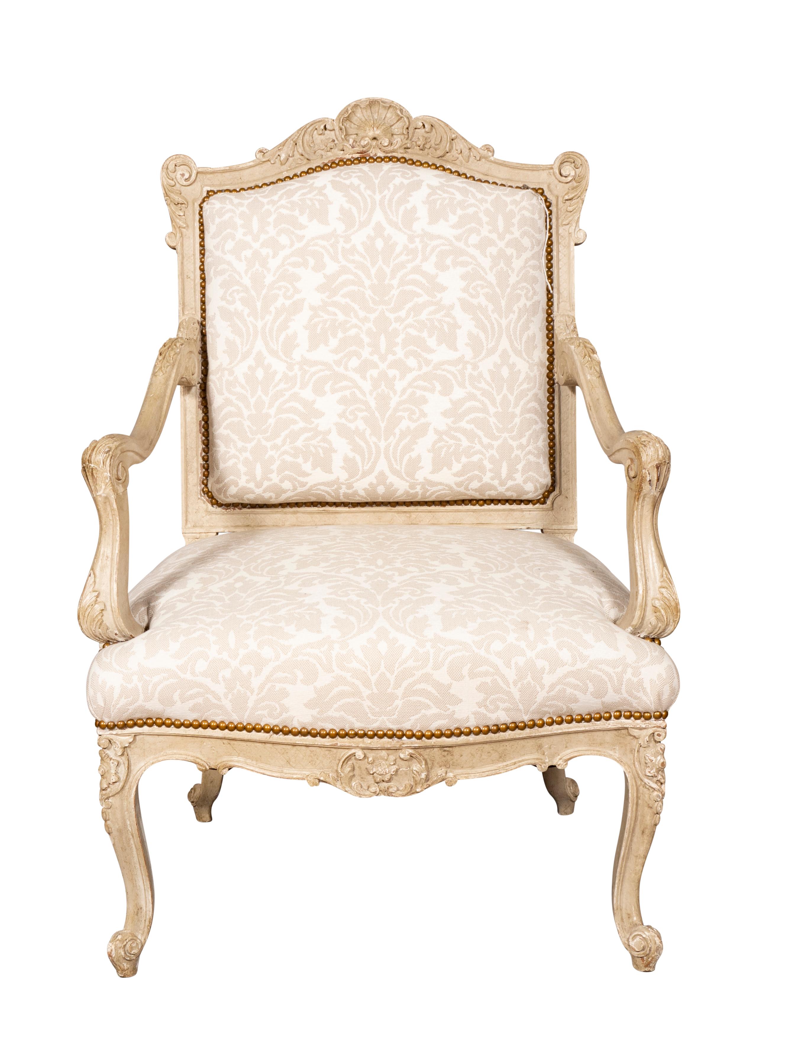 In the rococo style nicely carved with good scale and presence. Upholstery almost perfect.