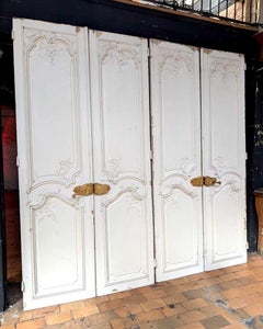 Par de puertas dobles de estilo Luis XV con decoración de estuco a doble cara, Francia