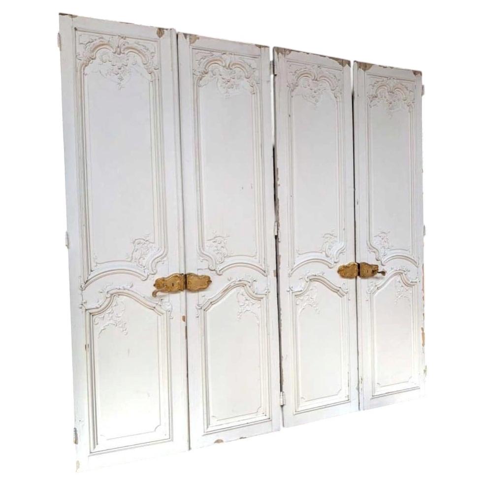 Par de puertas dobles de estilo Luis XV con decoración de estuco a doble cara, Francia