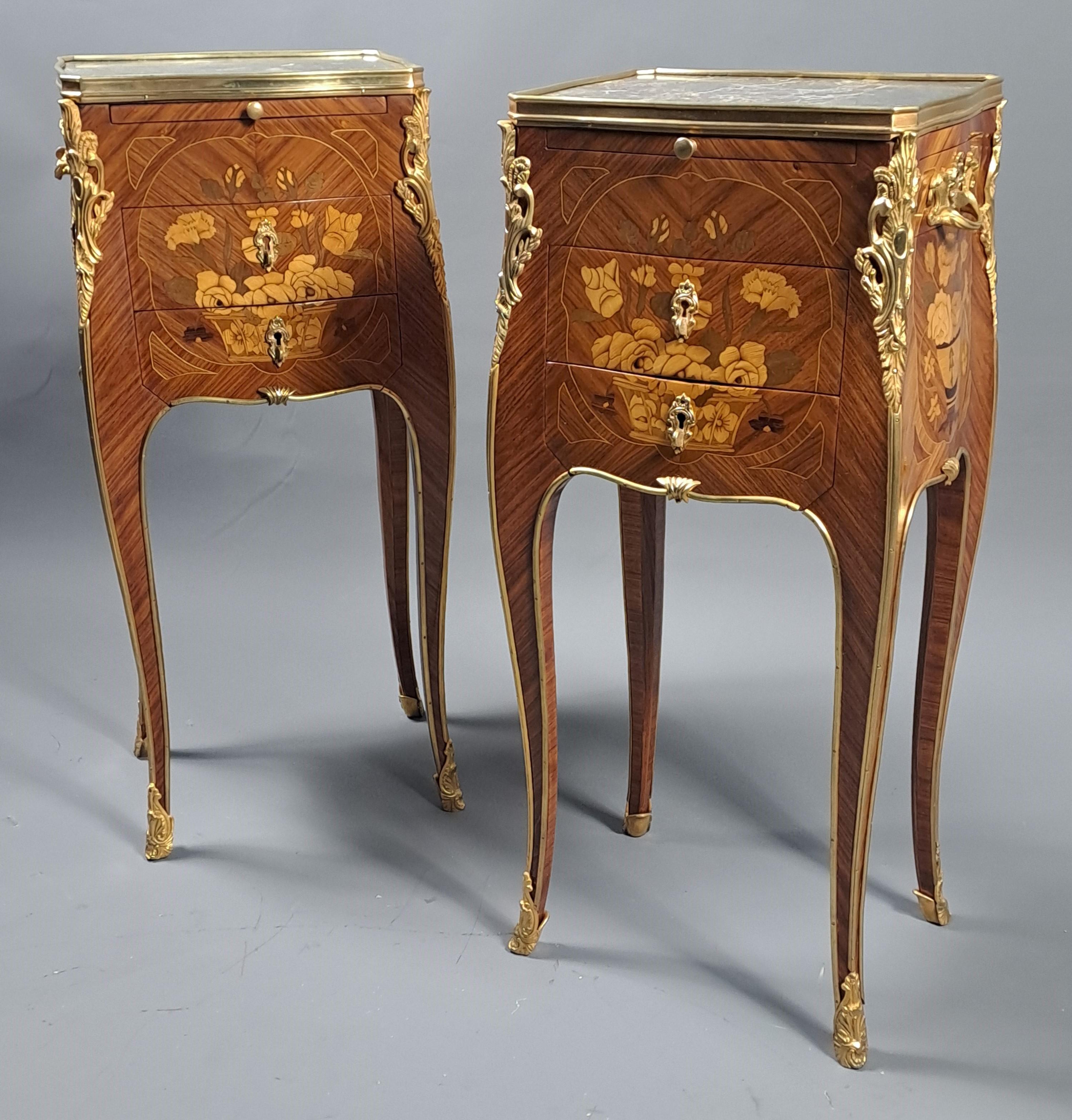 Rich ornamentation of finely chiseled gilded bronze, gray Saint Anne marble top.   

Opening two drawers on the front, one drawer on one side and a retractable shelf revealing a top of fawn leather decorated with a frieze gilded with fine gold.  