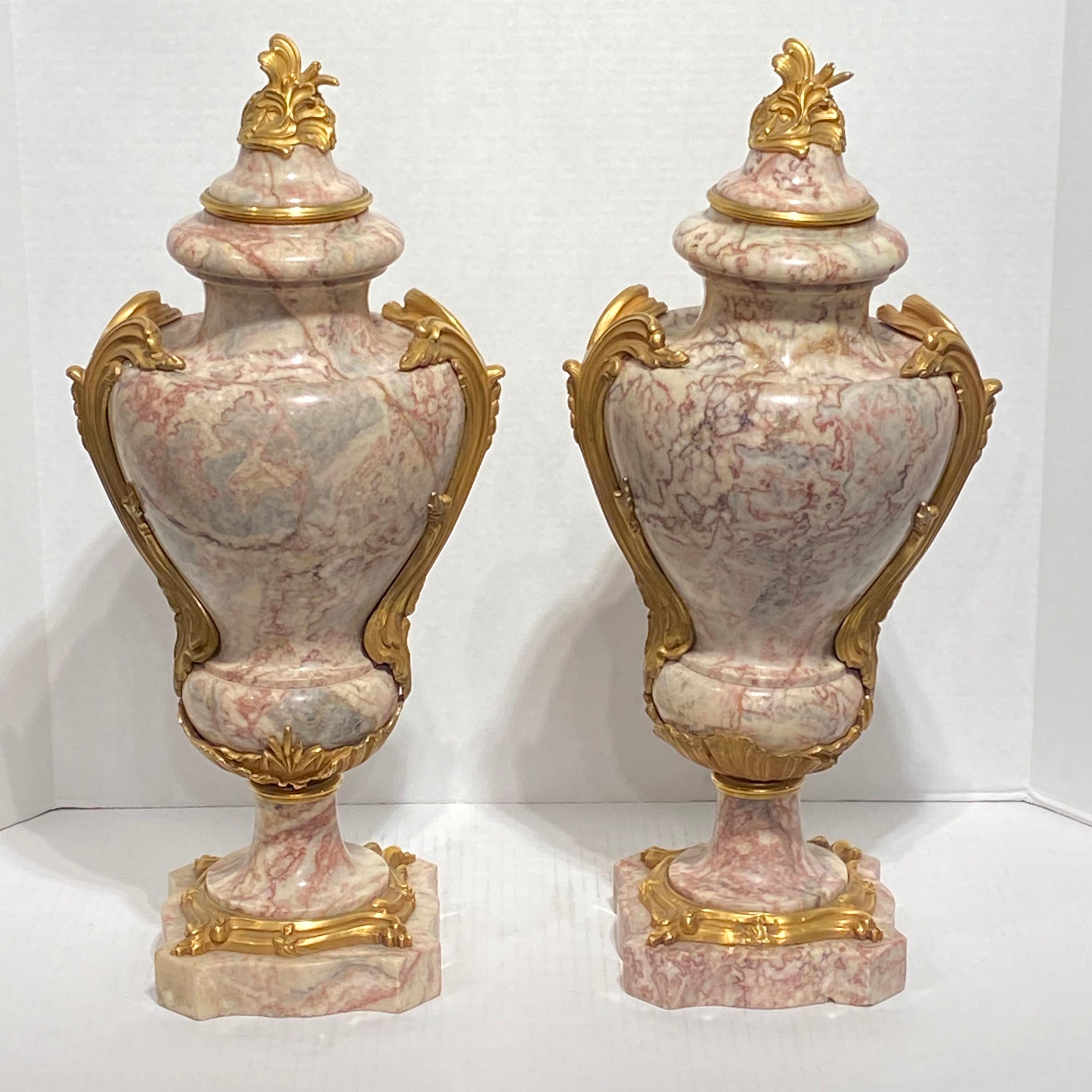 Pair of Louis XV style bronze and marble urns.
Stock number: DA163.