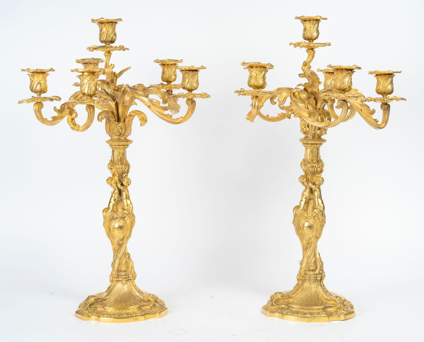 Pair of 19th century Louis XV style gilt bronze candelabra with 6 arms.
H: 55.5cm, W: 36cm, D: 36cm