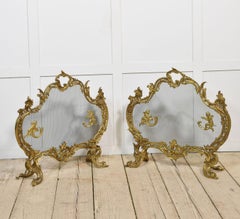 Pair of Louis XV style gilt bronze fire screens