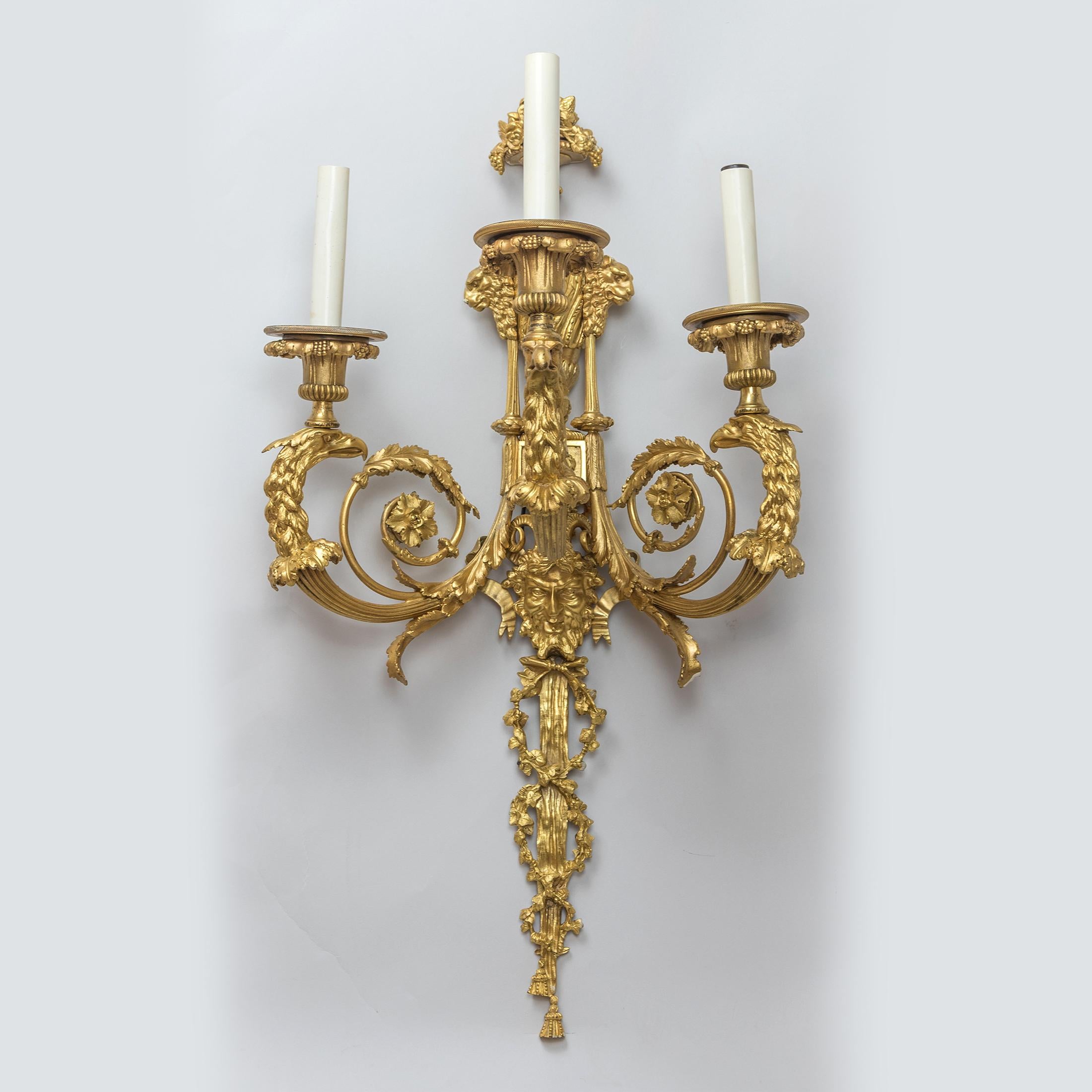 Magnificent pair of Louis XV style gilt bronze three-light wall sconces

Origin: French
Date: 19th century
Dimension: 25 1/4 in x 13 1/4 in x 10 3/4 inches.