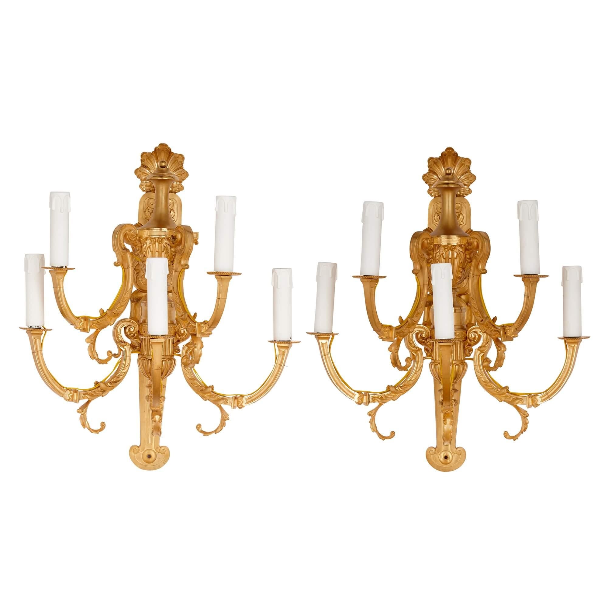 Pair of Louis XV style gilt-bronze wall lights by Barbedienne
French, late 19th century
Measures: height 51cm, width 41cm, depth 35cm

Signed for the leading bronzier and metalworker Ferdinand Barbedienne, this excellent pair of wall lights were