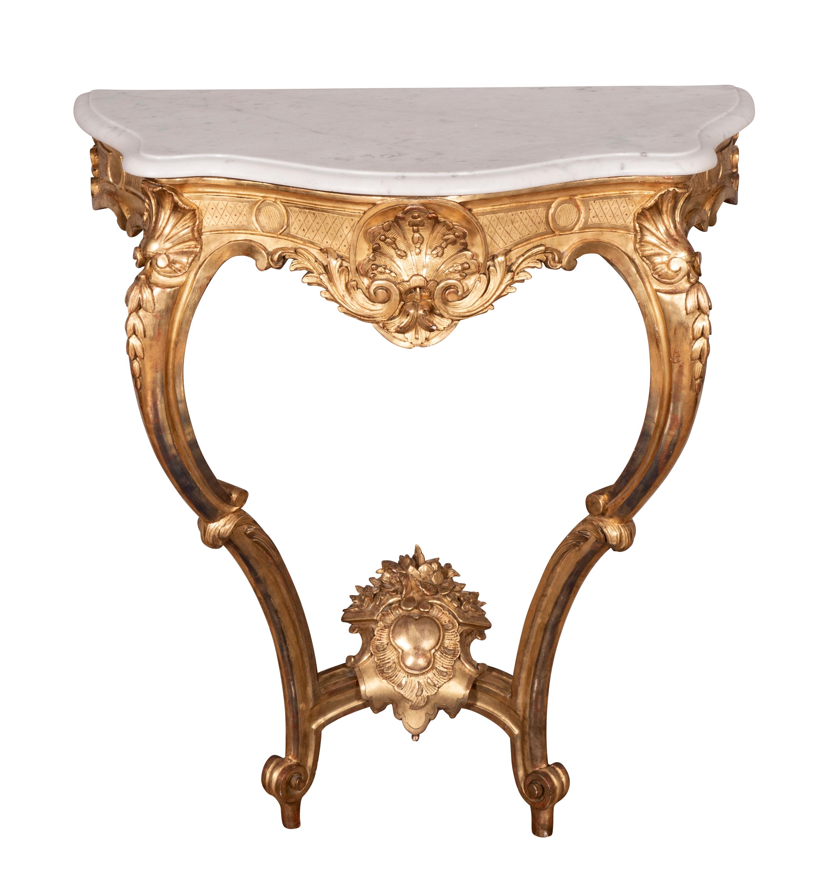 Each water gilded with 23ct gold leaf in excellent condition. Serpentine white marble top over a conforming frieze with central shell and surrounded by diaperwork. Raised on cabriole legs headed by shell decoration. Lower central cartouche at