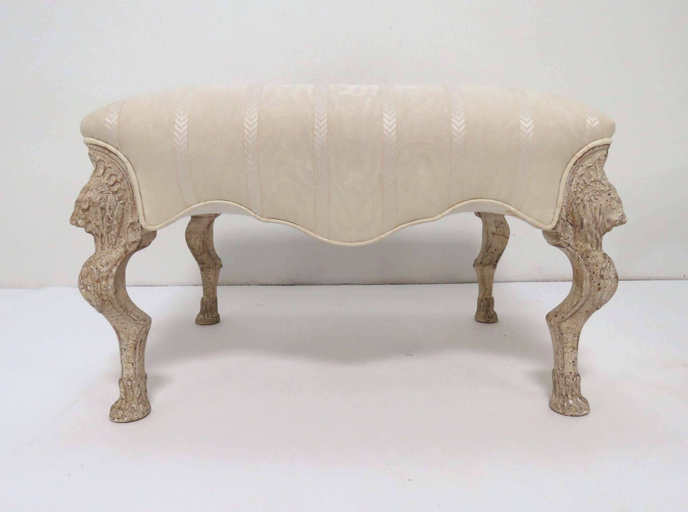 Pair of generously proportioned hassocks or ottomans in the manner of Louis Quinze. In limed finish with griffin carved legs and elegantly arched skirts.