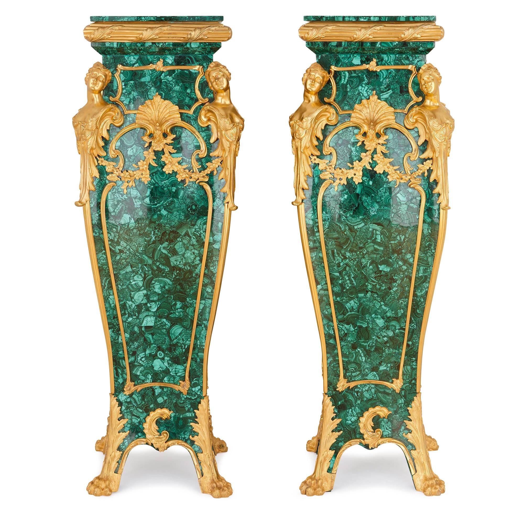 This brilliant pair of pedestals, finished in cool green malachite and with beautiful ormolu mounts, are statement pieces in the truest sense. Made for bold, glamorous interiors, they wonderfully combine modern design sensibilities with the graceful