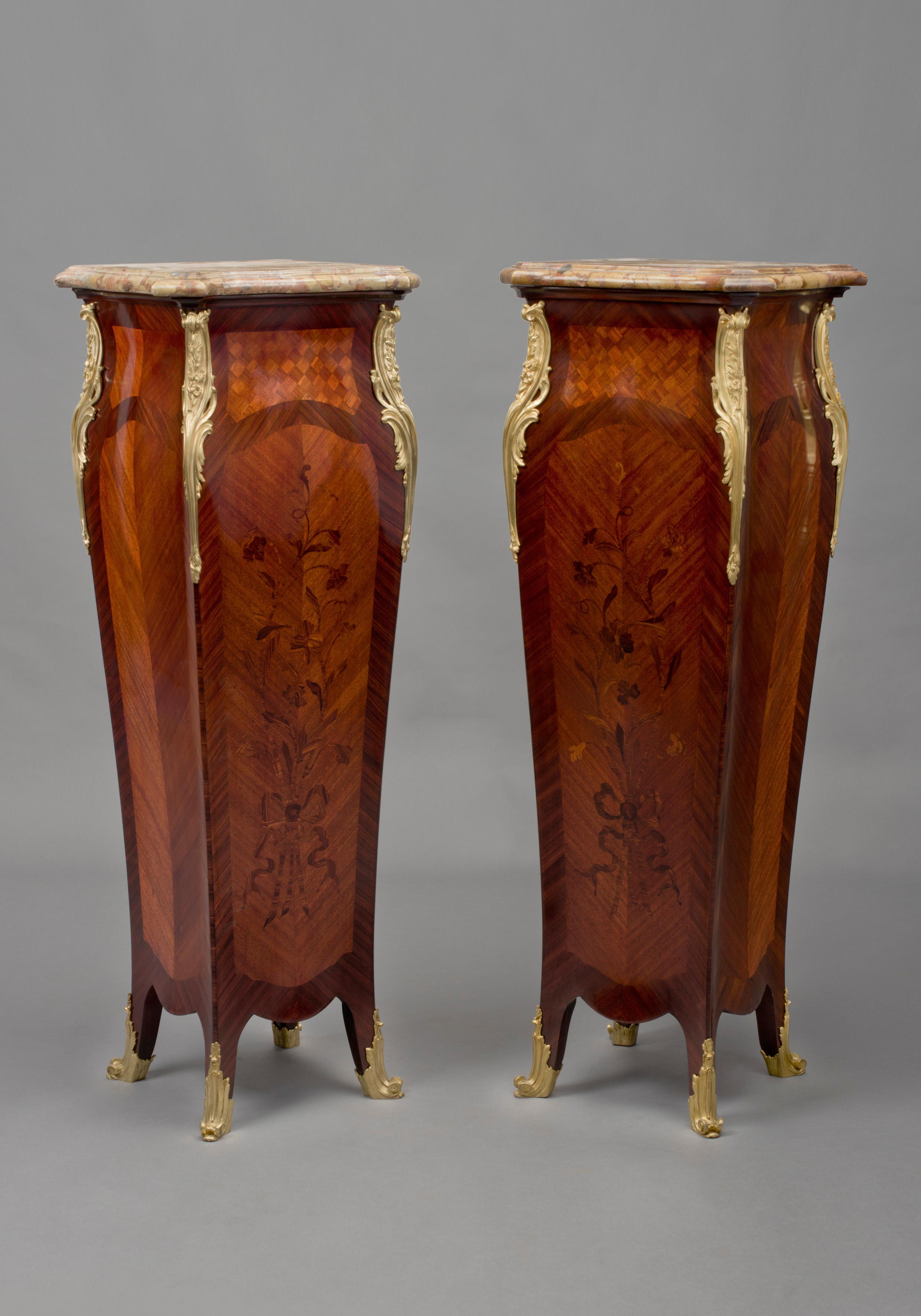 A very fine pair Of Louis XV style gilt bronze mounted marquetry inlaid pedestals, firmly attributed to Maison Millet.

French, circa 1880. 

This elegant pair of Louis XV style pedestals have shaped brèche d'Alep marble tops, above bombe shaped