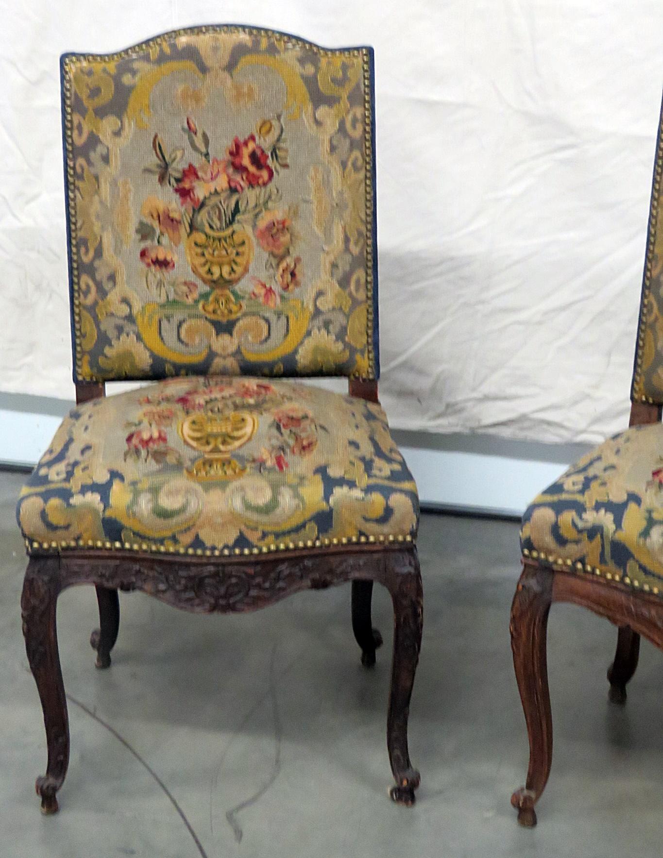 Pair of Louis XV style needlepoint side chairs with nailhead trim.