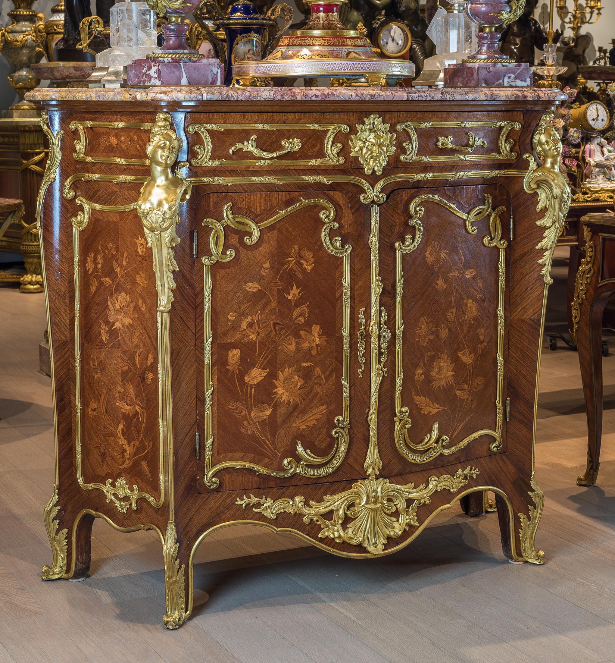 An exquisite pair of Louis XV style ormolu-mounted amaranth and tulipwood marquetry meuble à hauter d'appui credenzas attributed to F. Linke at Fontainebleau. 

Each credenza has a marble top with a central frieze drawer and a large lower