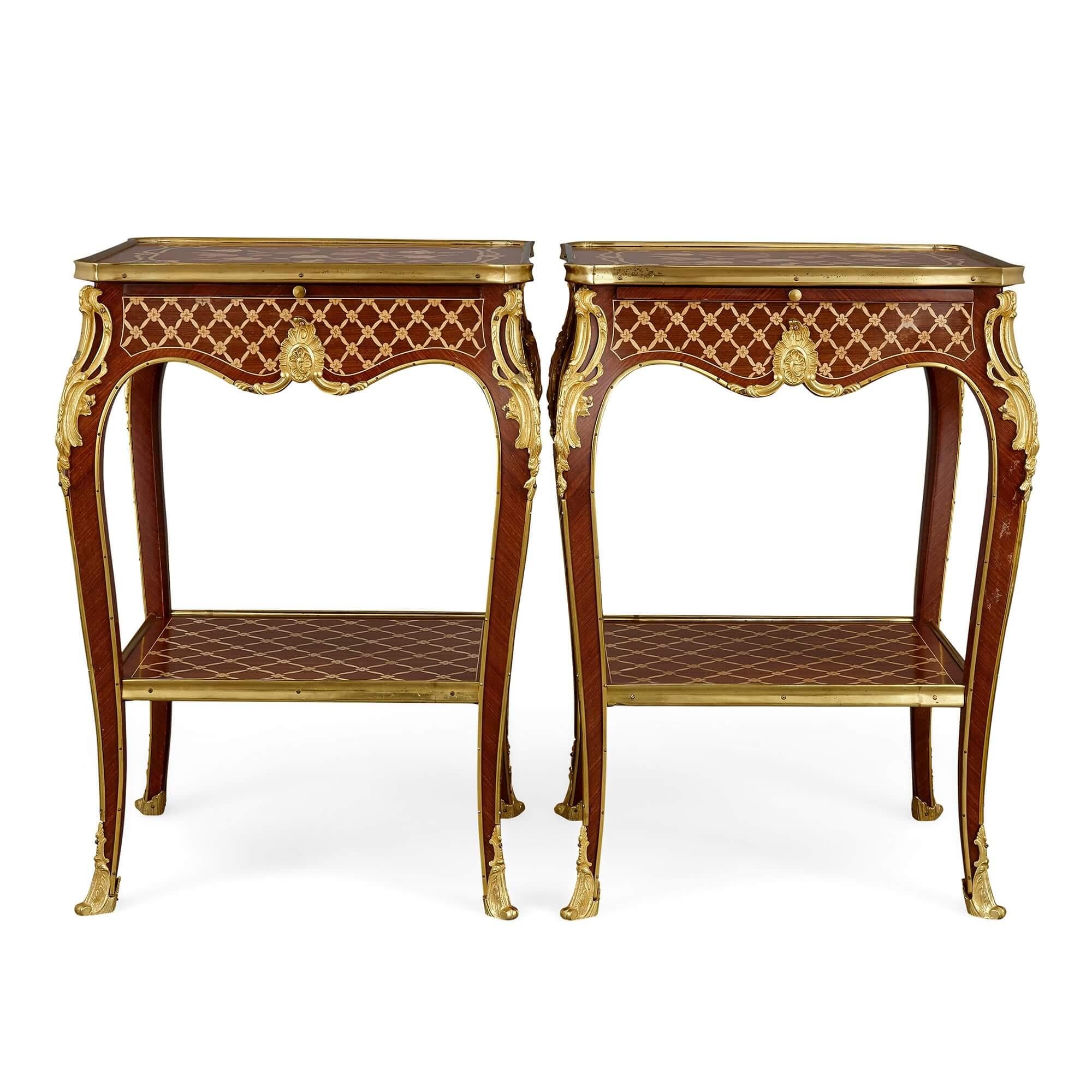 Featuring marquetry, parquetry, and gilt-bronze decoration, these intricate and elaborate side tables are crafted in stunning Rococo and Louis XV fashion. 

This pair of Louis XV style side tables are decorated with a trio of techniques to form a