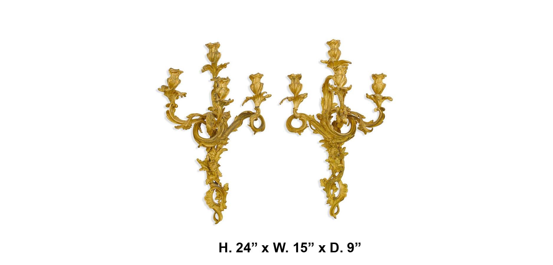 Apposing pair of 19 century French Louis XV style ormolu three light sconces with meticulous attention given to every detail of the rocaille and acanthus motif

Measures: height 24in, width 15in, depth 9in.
