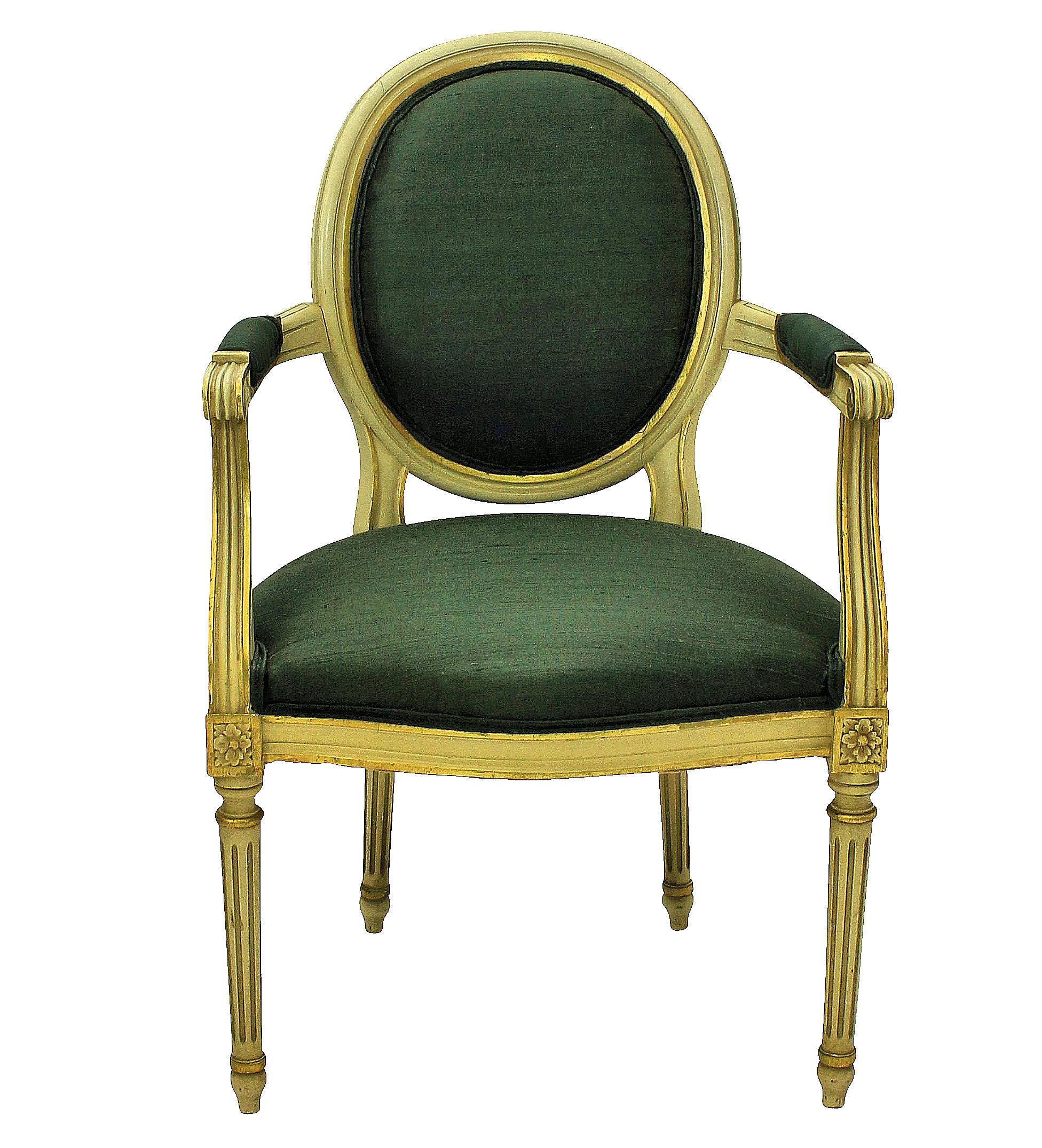 A pair of French painted and gilded Louis XV style armchairs upholstered in sage green silk.
 
