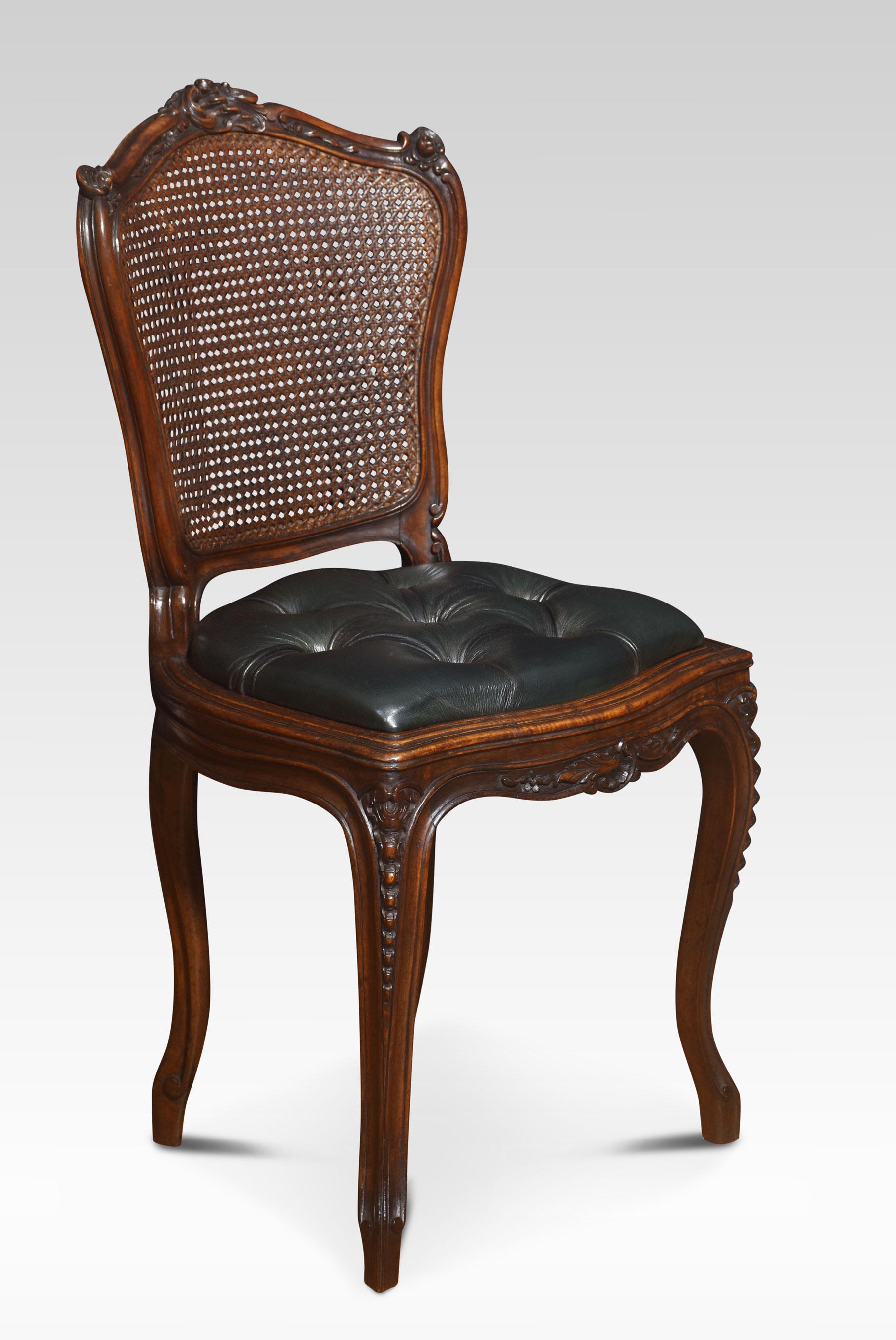 Pair of French Louis XV side chairs, the carved rail in the typical manner of the period, with detailed leaf motifs. to the canework back and deep buttoned leather seat. All raised up on four carved tapering cabriole legs
Dimensions
Height 34 Inches