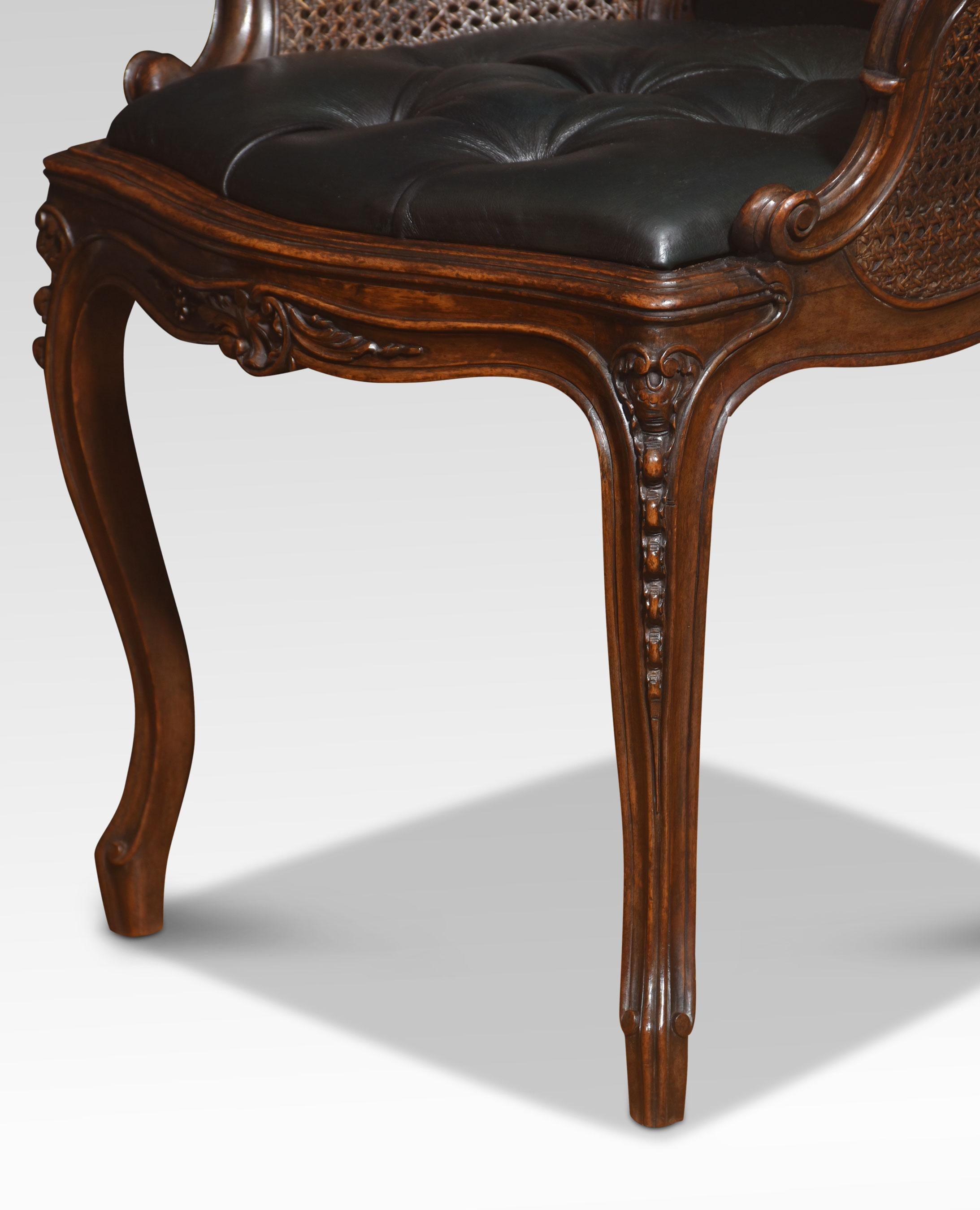 Pair of French Louis XV side chairs, the carved rail in the typical manner of the period, with detailed leaf motifs. to the canework back and deep buttoned leather seat. All raised up on four carved tapering cabriole legs
Dimensions
Height 34 Inches