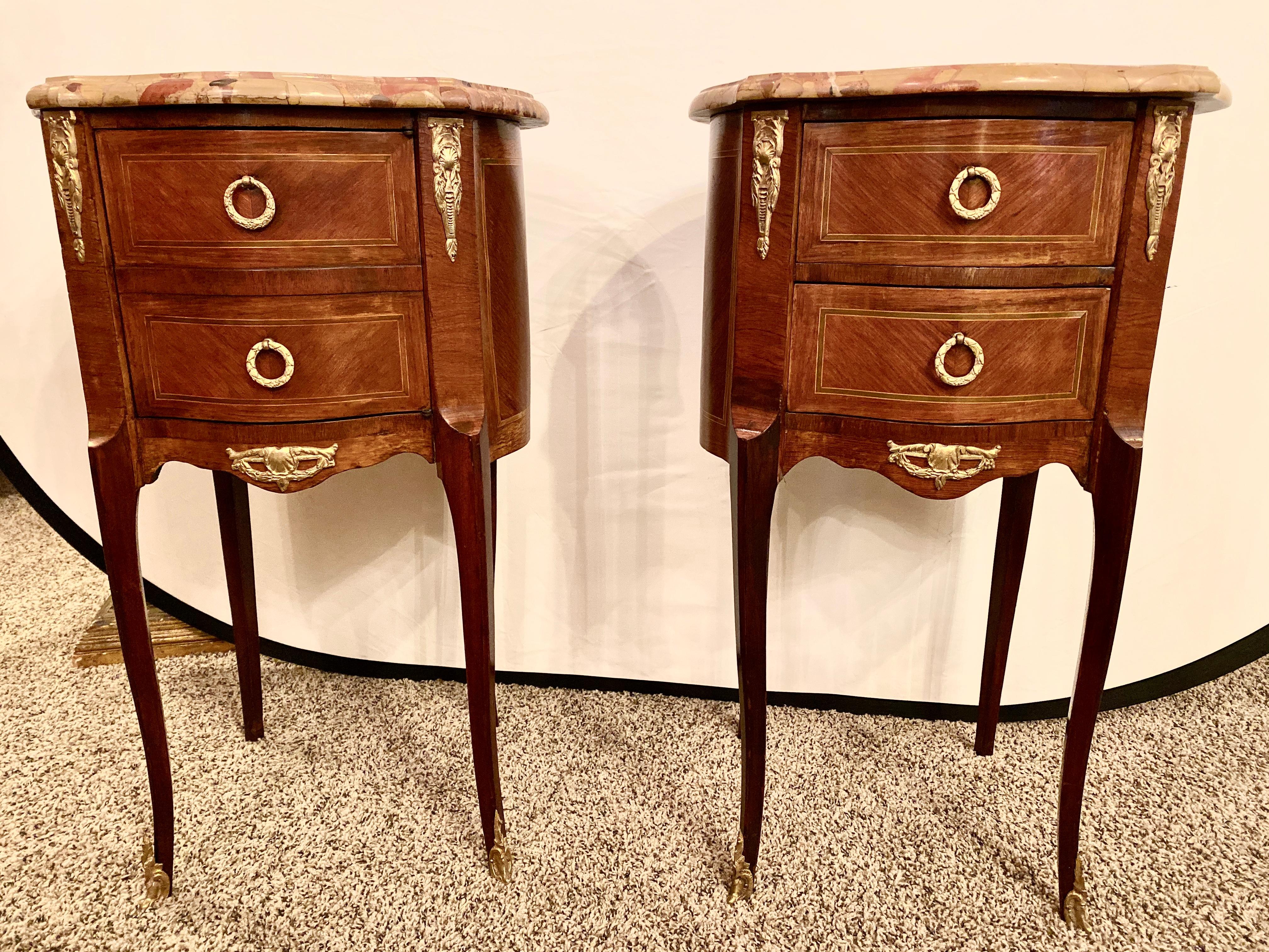 Pair of Louis XV style side / end tables with Breche D'alep original marble tops and bronze mounts. One table with two drawers, the other with front faux drawers to a cupboard, Late 19th century.
hSX.