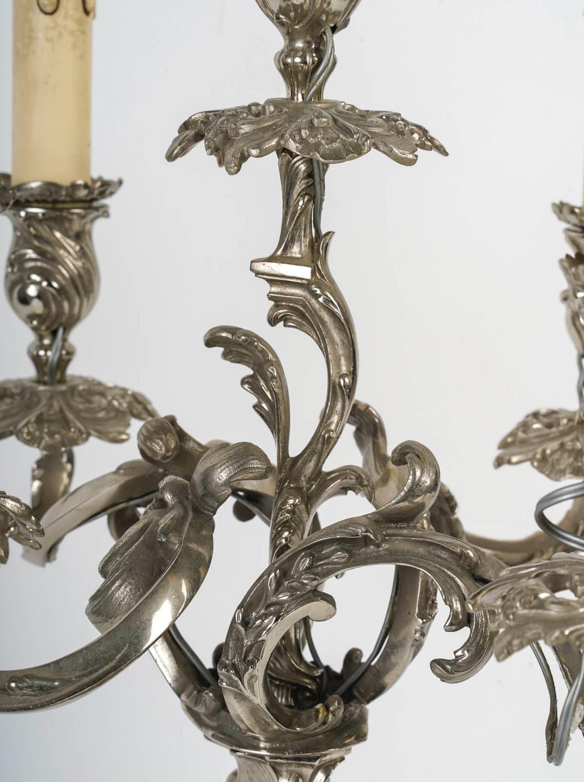 Pair of Louis XV style silver plated bronze candelabra, 19th Century.

A pair of Louis XV style silvered bronze candelabras, electrically mounted, each with 5 arms.
h: 50cm, d: 33cm