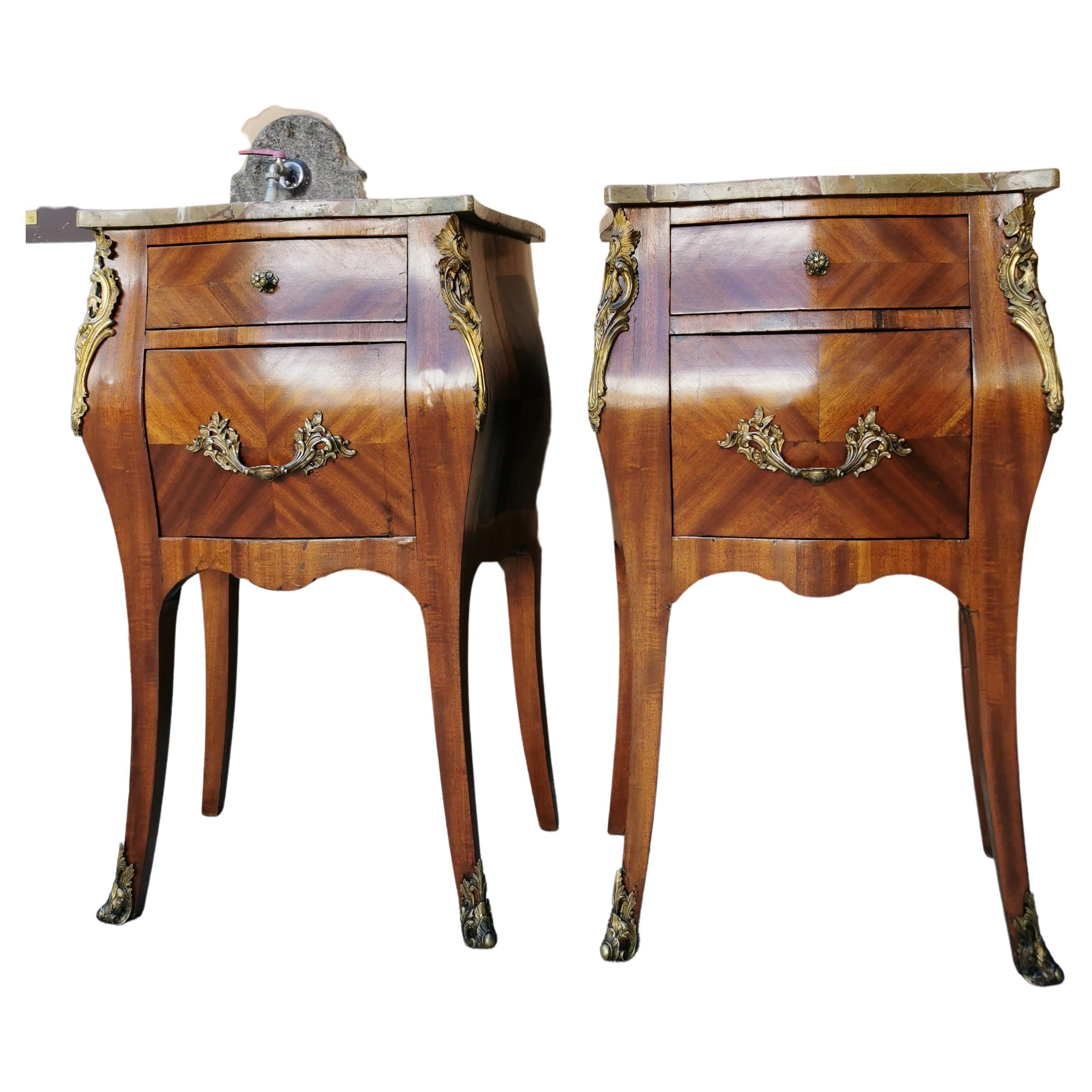 Pair of Marquetry side commodes with marble top nd bronze details. Louis XV style and end of 19th century France 
has been restored. Rosewood, walnut, marble and gilded bronze
will be shipped inside a secured wood crate.
  