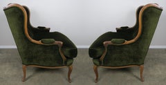 Pair of Louis XV Style Walnut and Green Velvet Wingback Bergères