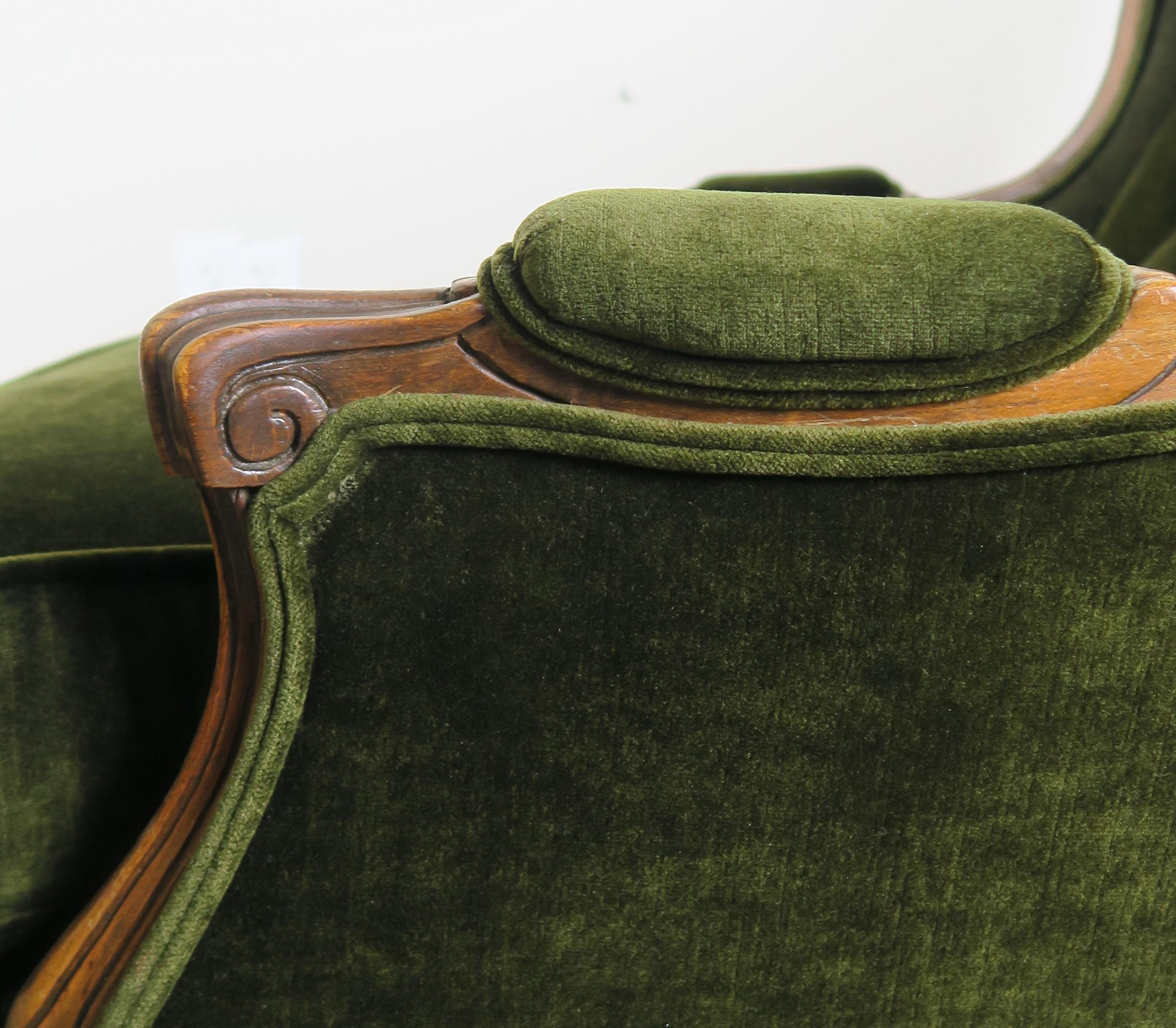 French Pair of Louis XV Style Walnut and Green Velvet Wingback Bergères