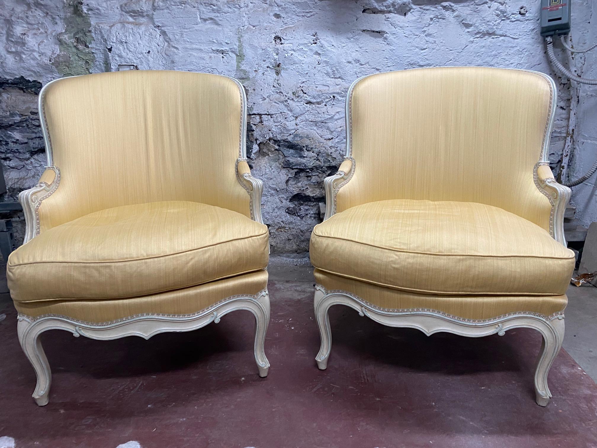 Pair of Louis XV style yellow upholstered painted wood bergère Chairs.
Measure: Seat height 17.5 in.