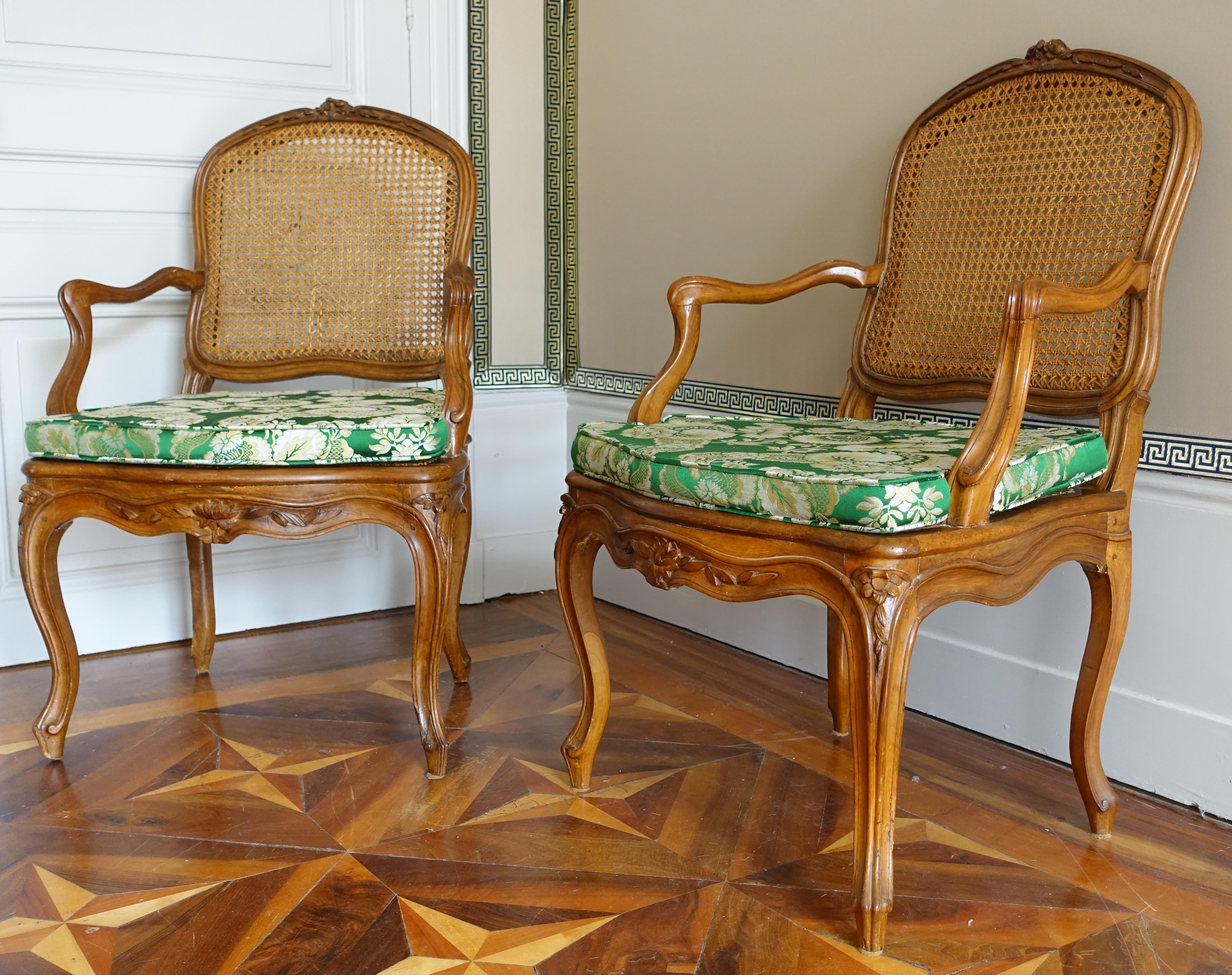 A fine pair of walnut caned armchairs, mid 18th century, Louis XV period circa 1750 - Lyon area.
Our seats are very elegantly carved and balanced ; although they are not stamped, they are the work of a talented seat maker from Lyon : using walnut is