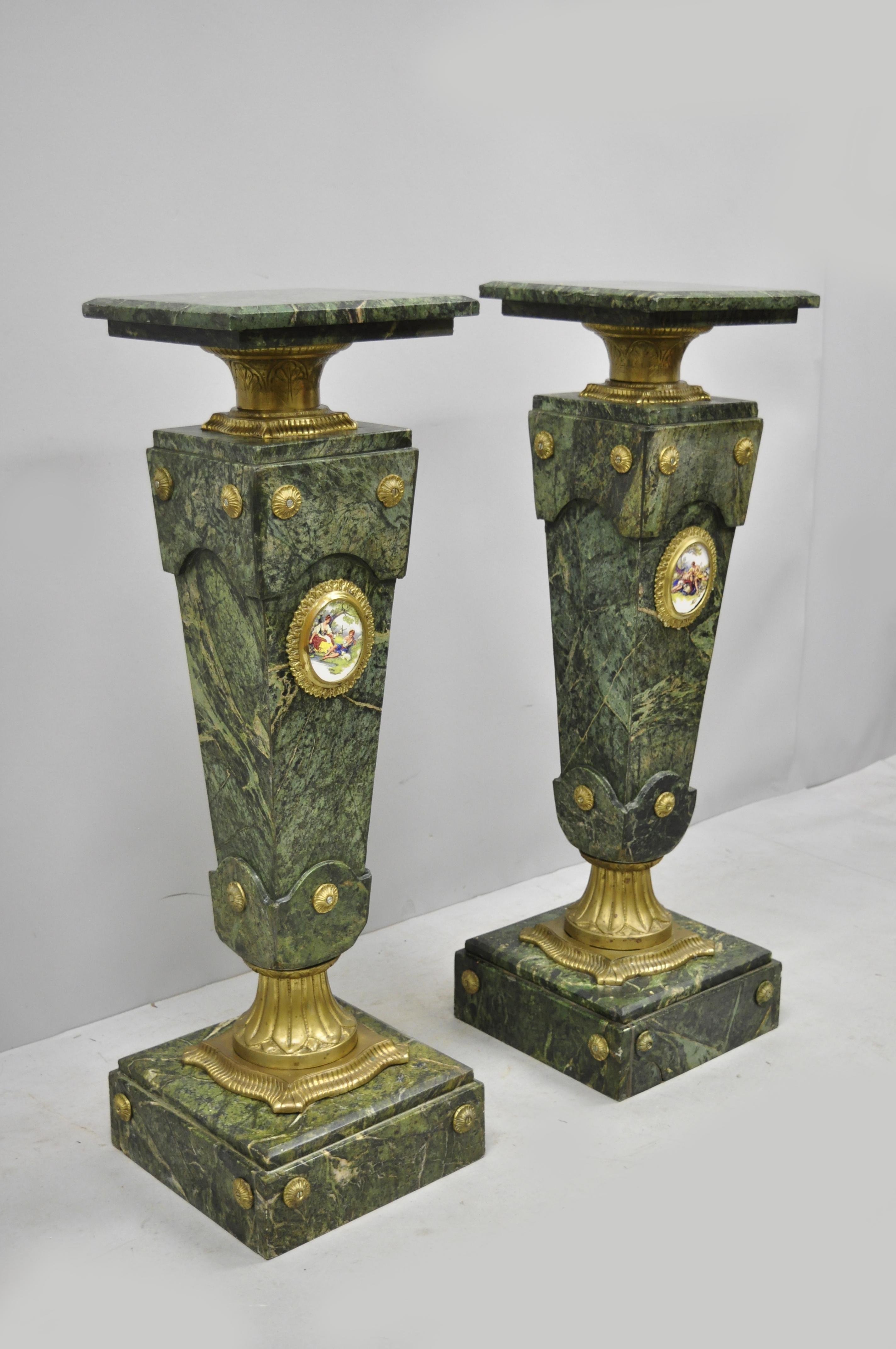 Pair of Louis XV XVI French Style Green Marble Pedestal Stands w/ Bronze Ormolu. Items feature Brass/Bronze ormolu, green marble construction, porcelain figural plaque to fronts, great style and form, approximately 110lbs each. Circa Late 20th