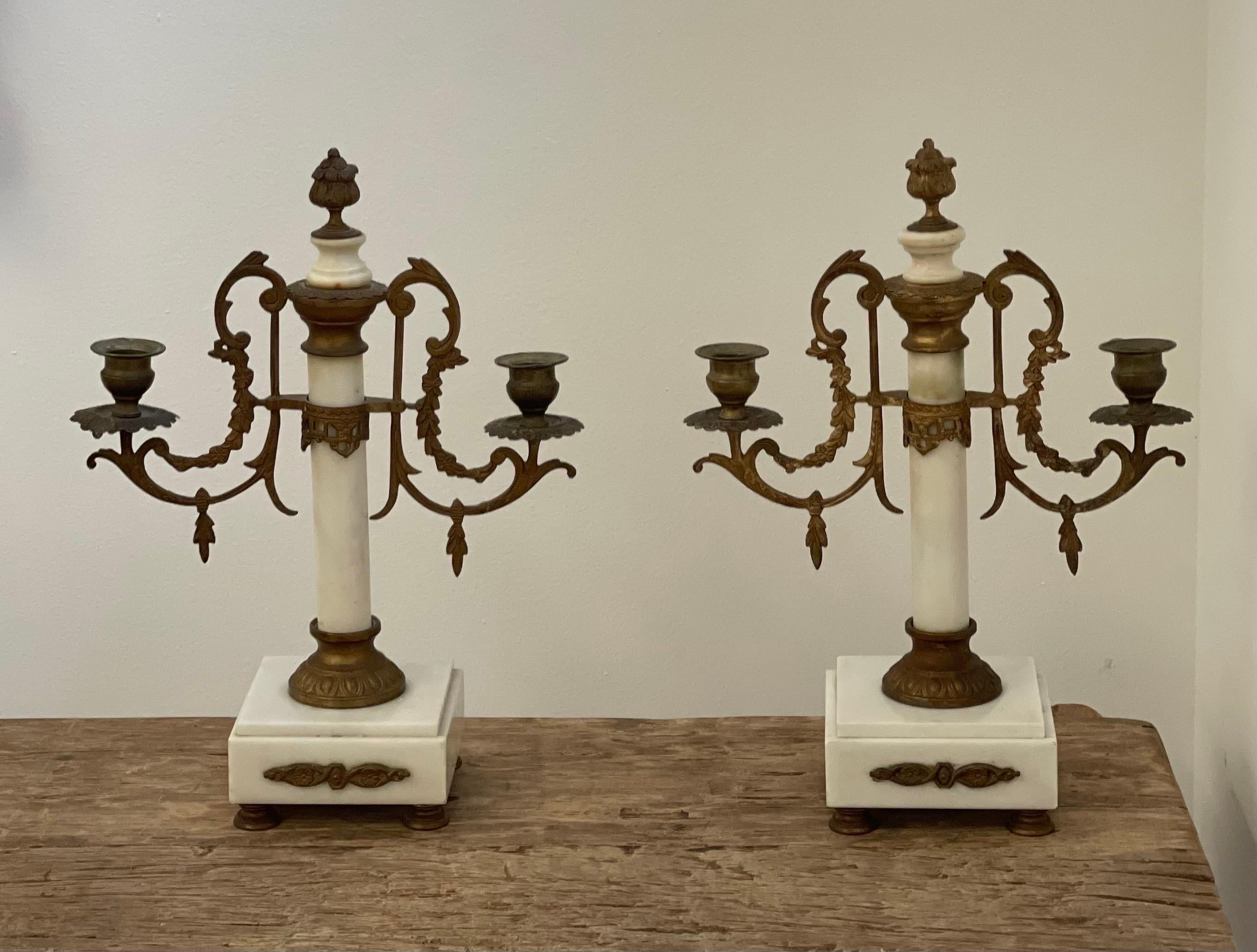 Pair of Louis XVI Style 19th century gilt-bronze and gilt-metal and marble candelabra.

Dimensions: 11W, 4D, 13H.