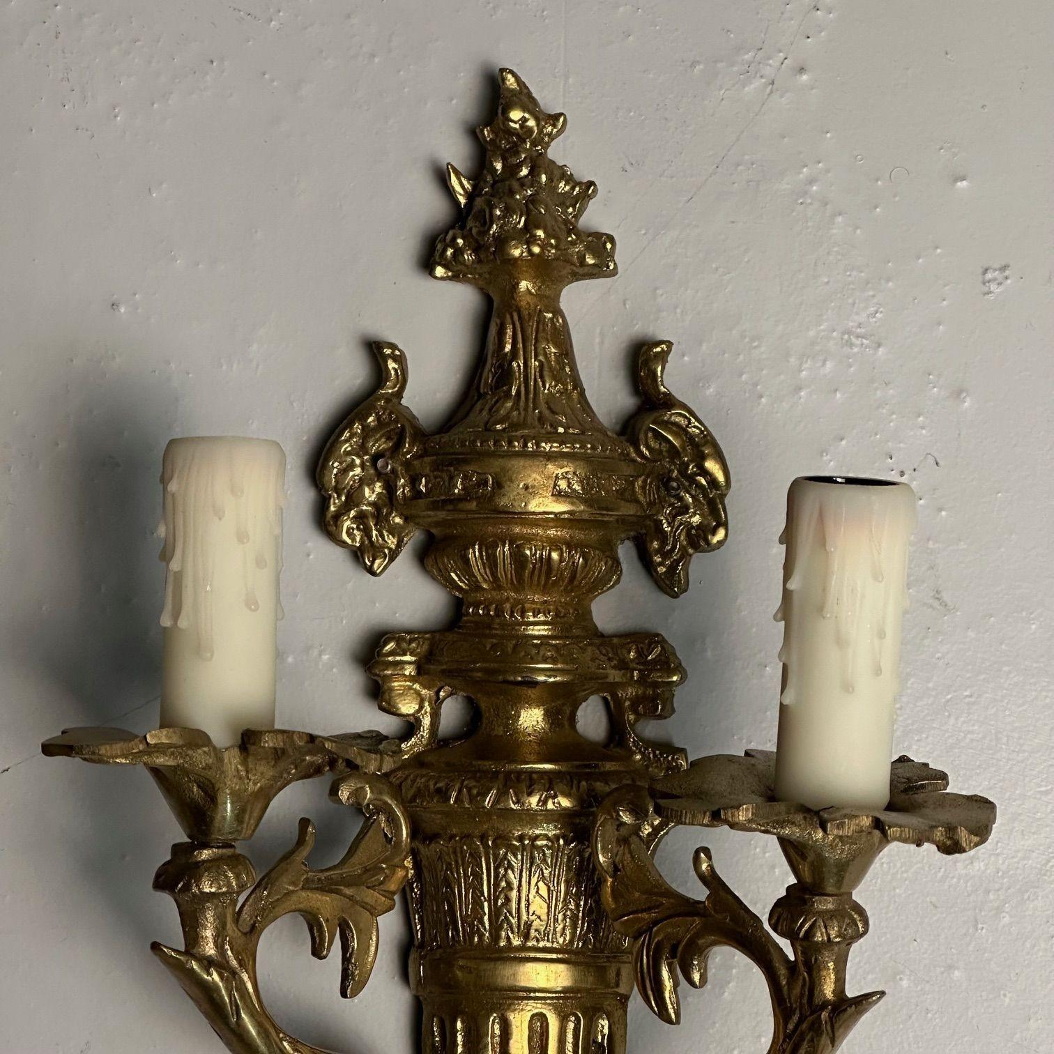 Pair of Louis XVI / Adams Style Bronze Ornate Sconces, Two Light, France, 1940s

A finely crafted pair of 1940s wall lights in the traditional style. Wired. Fair condition. Small piece missing on upper left hand corner of one sconce. Can remove all