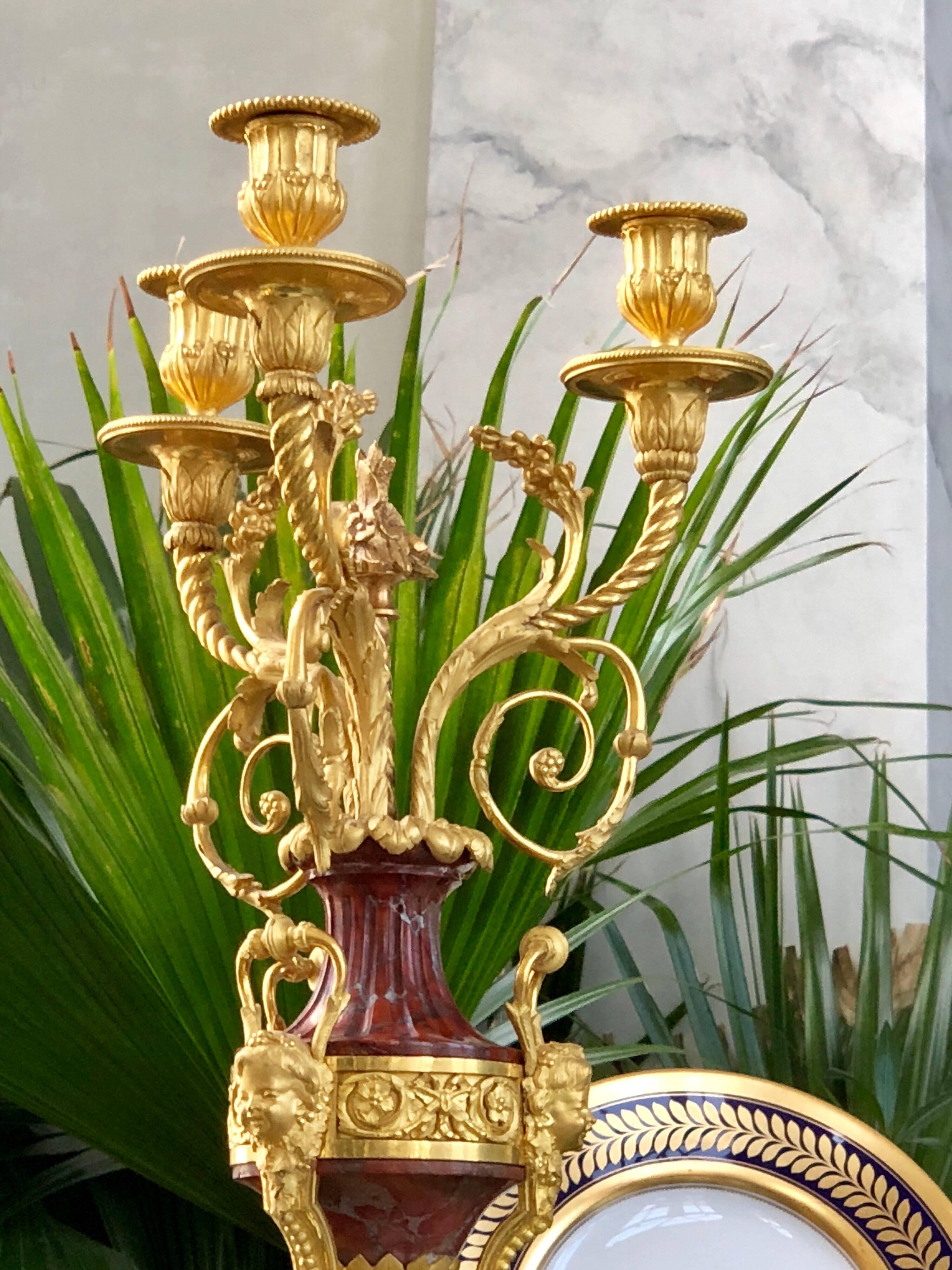 Exquisite pair of French Louis XVI style red marble and two-tone Ormolu. These are of the highest quality and execution and probably attributable to one of France’s best bronziers.