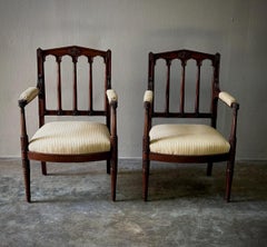 Pair of Louis XVI Carved Mahogany Fauteuils by George Jacob