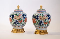 Pair of Louis XVI Dore Bronze Mounted Chinese Porcelain Wucai Covered Urns