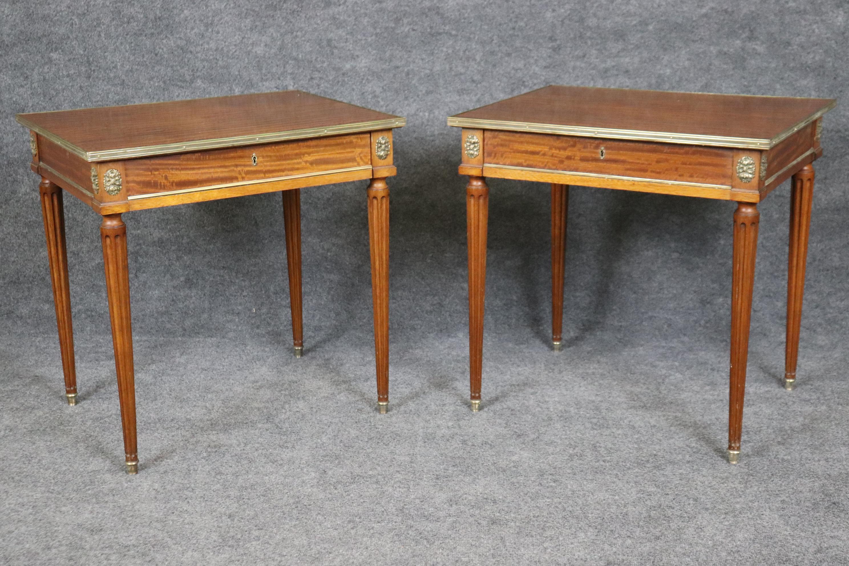 Dimensions - H: 26 1/4in W: 26 1/4in D: 21in

This Pair of Louis XVI French Jansen Style Brass Mounted End Tables are truly something to be seen! If you look at the photos provided you will see the attention to detail within the brass hardware and
