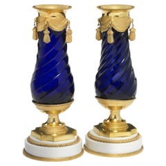 Pair of Louis XVI Gilt Bronze and Blue Glass Vases on White Porcelain Bases