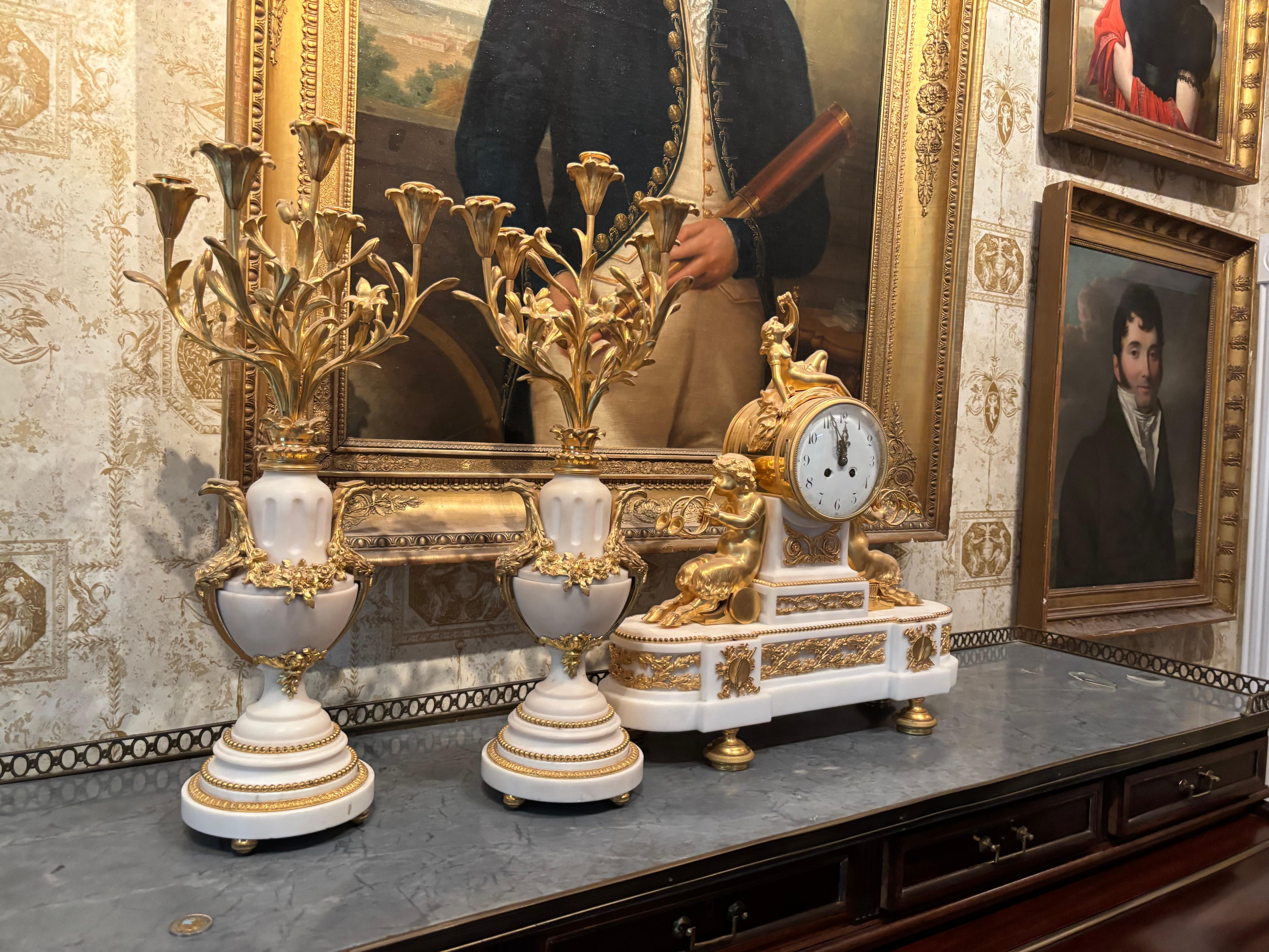 Pair of Louis XVI Gilt Bronze and White Marble Five-Arm Candelabra 1