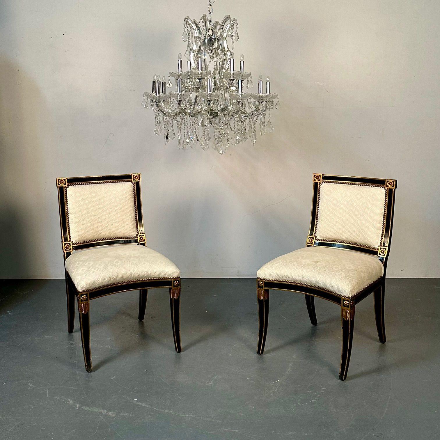 Pair of Louis XVI Maison Jansen Style Dining / Side Chairs, Ebony and Giltwood

This finely crafted pair of Italian ebonized side chairs each having sprayed legs with gilt decorative over tones. The pair with square padded and tacked backs and