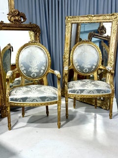 19th Century Pair of Louis XVI Medallion Giltwood Armchairs with Blue Damask