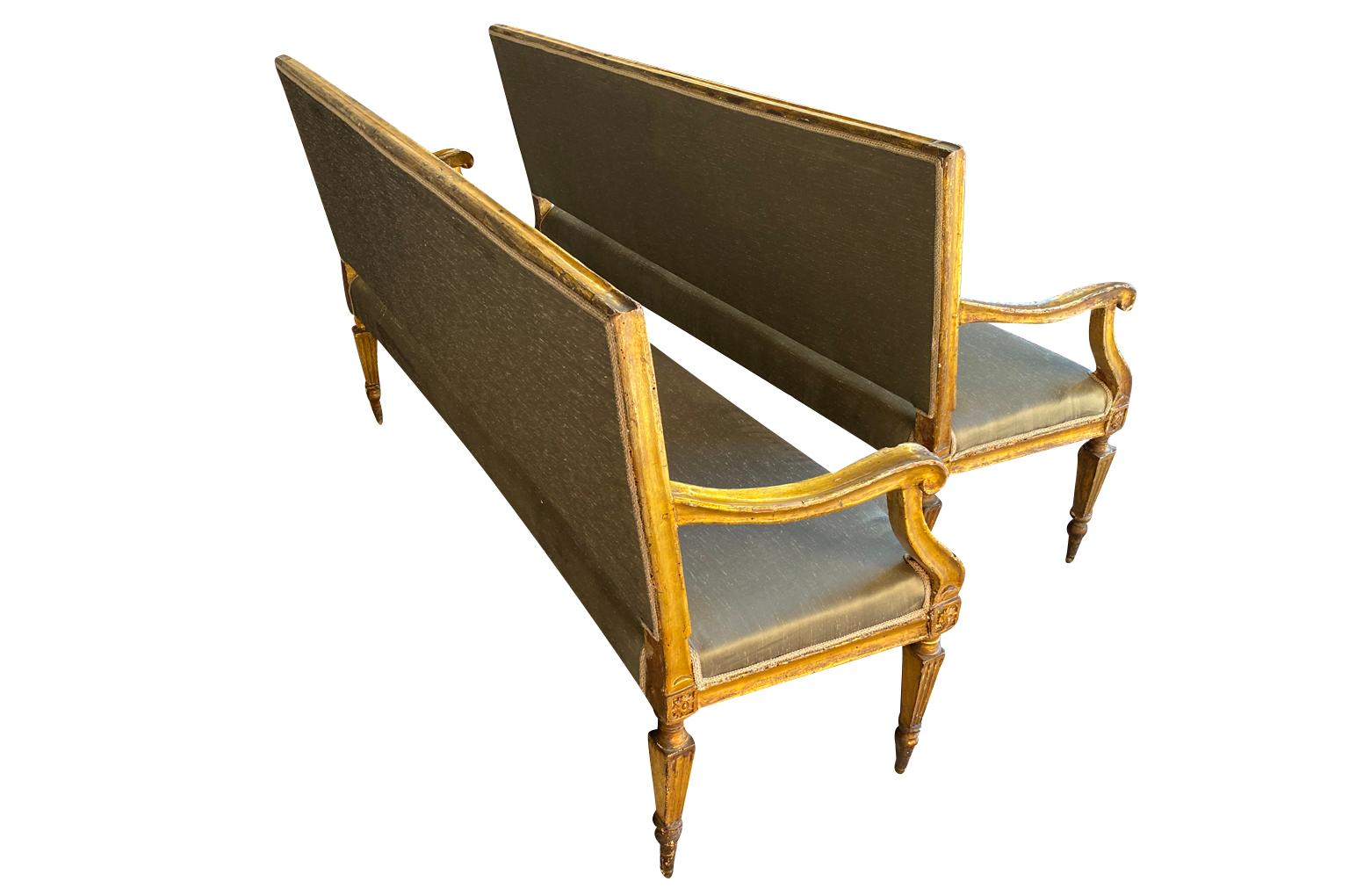 An outstanding pair of 18th century Louis XVI period Banquettes from Venice, Italy. Beautifully constructed from gilt wood. Wonderful patina. Perfect accents for an elegant surrounding.