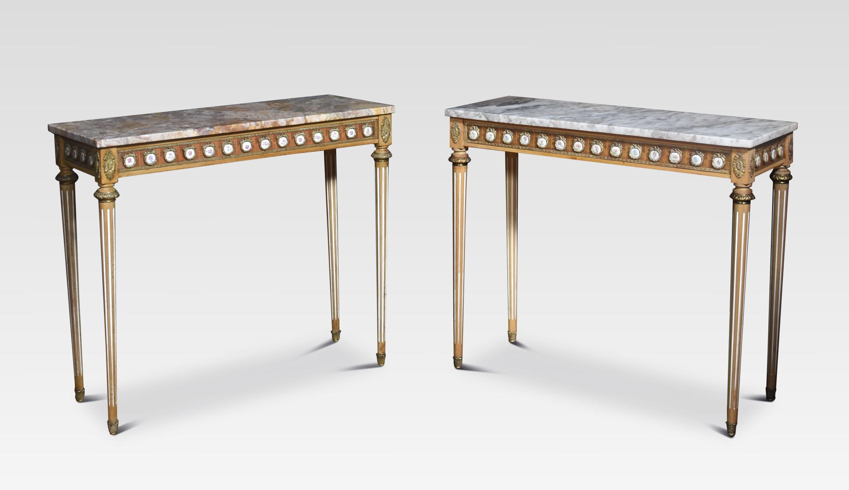 Pair of Louis XVI revival console tables by H & L Epstein, the rectangular well-figured marble top to the freeze having gilt metal mounts, and enamel plaques. Raised up on fluted tapering supports.
Dimensions
Height 31.5 Inches
Width 36.5