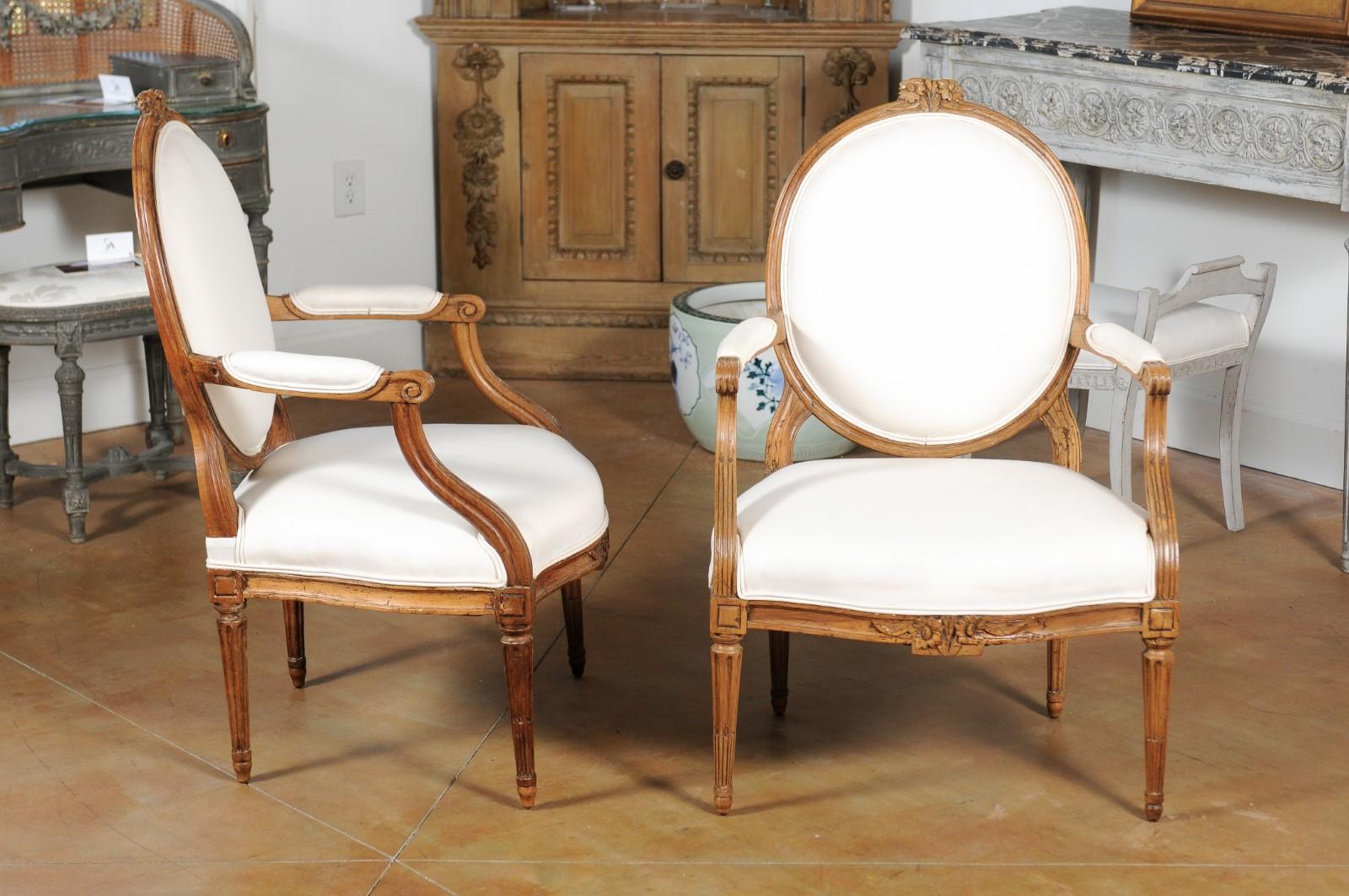 Pair of Louis XVI Style 19th Century Oval Back Fauteuils with Floral Motifs In Good Condition In Atlanta, GA