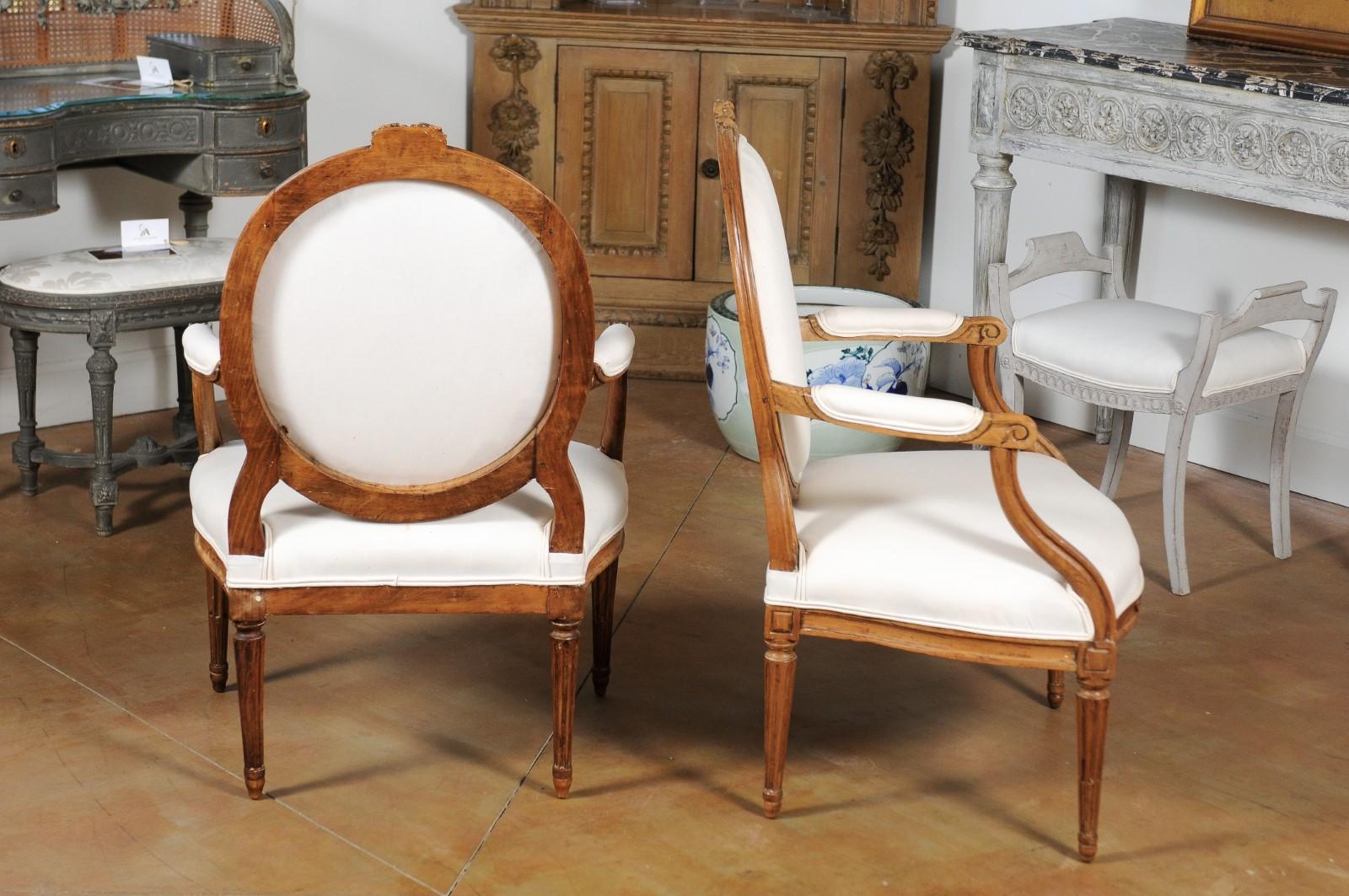 Pair of Louis XVI Style 19th Century Oval Back Fauteuils with Floral Motifs 1