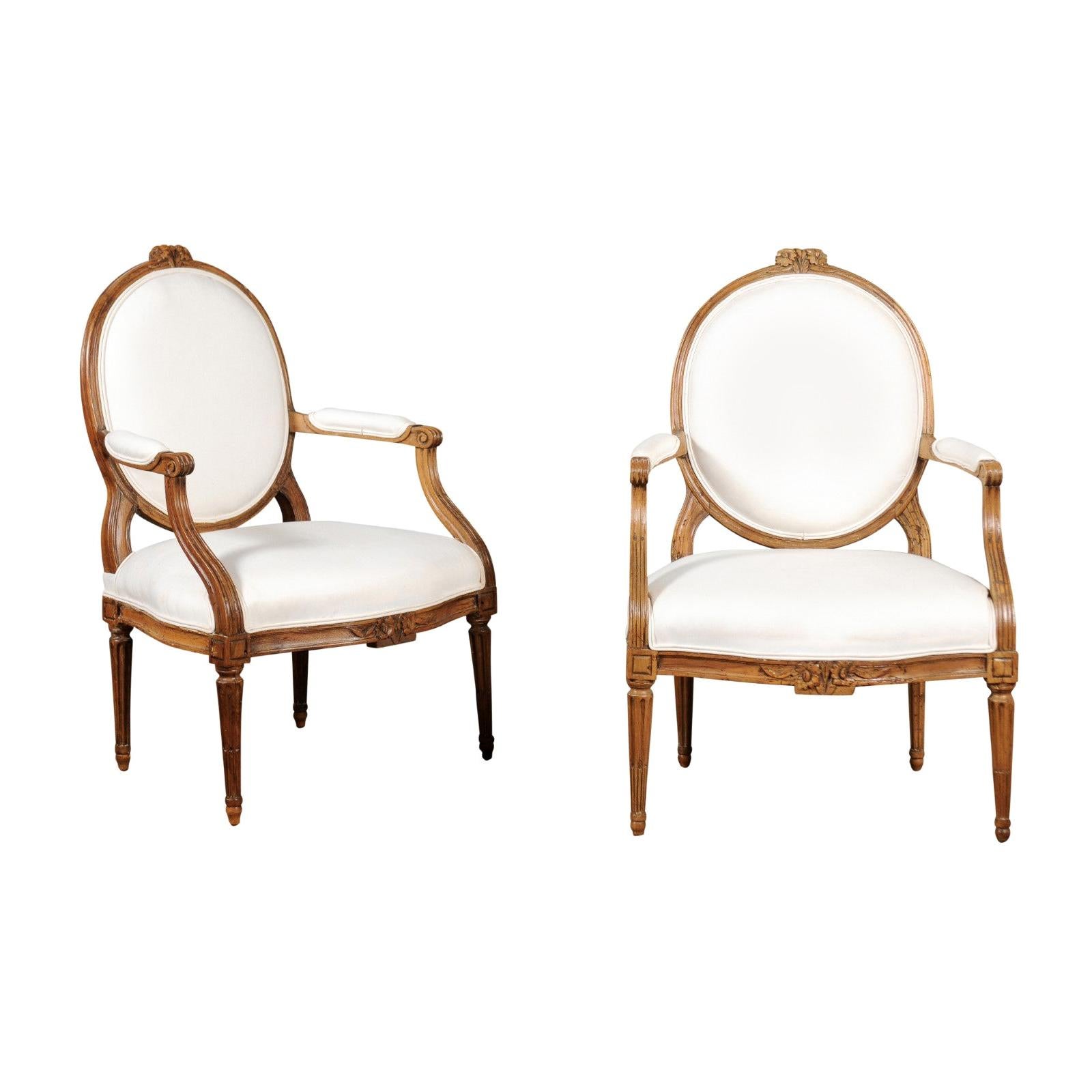 Pair of Louis XVI Style 19th Century Oval Back Fauteuils with Floral Motifs